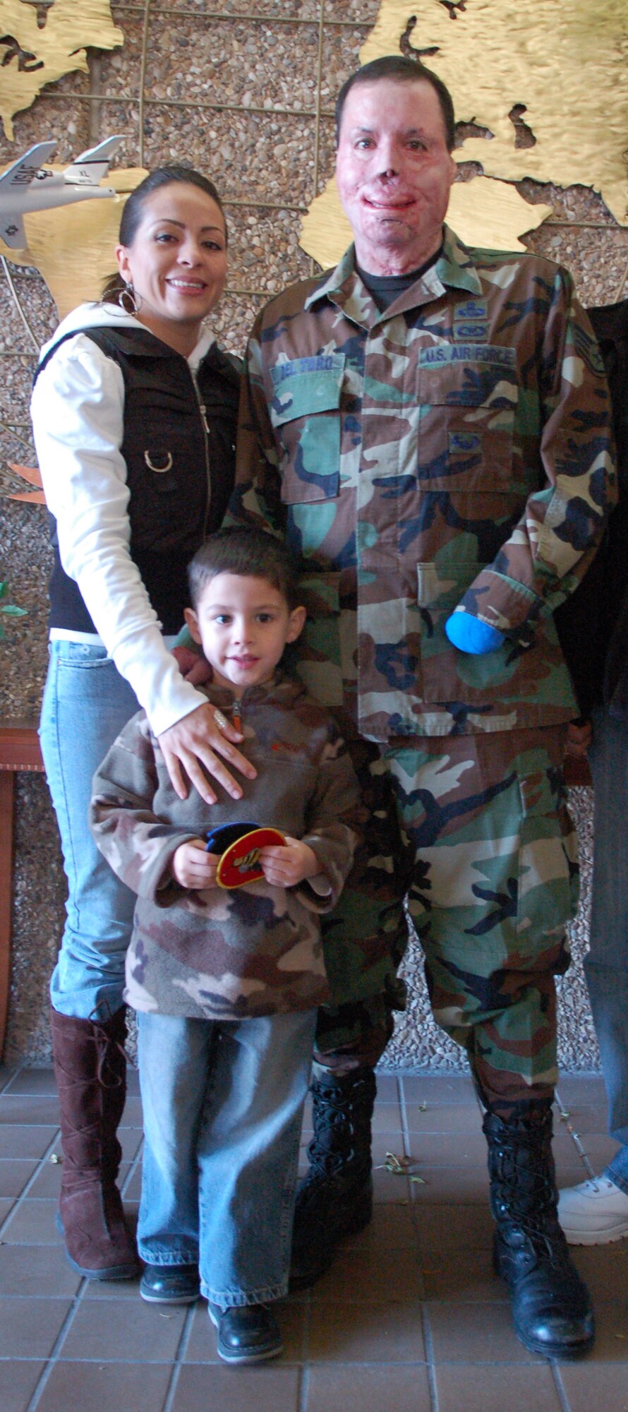The Del Toro family in December 2006.  Last August, the couple finally had the church wedding of their dreams in Joliet, Ill.  (Air Force photo)
