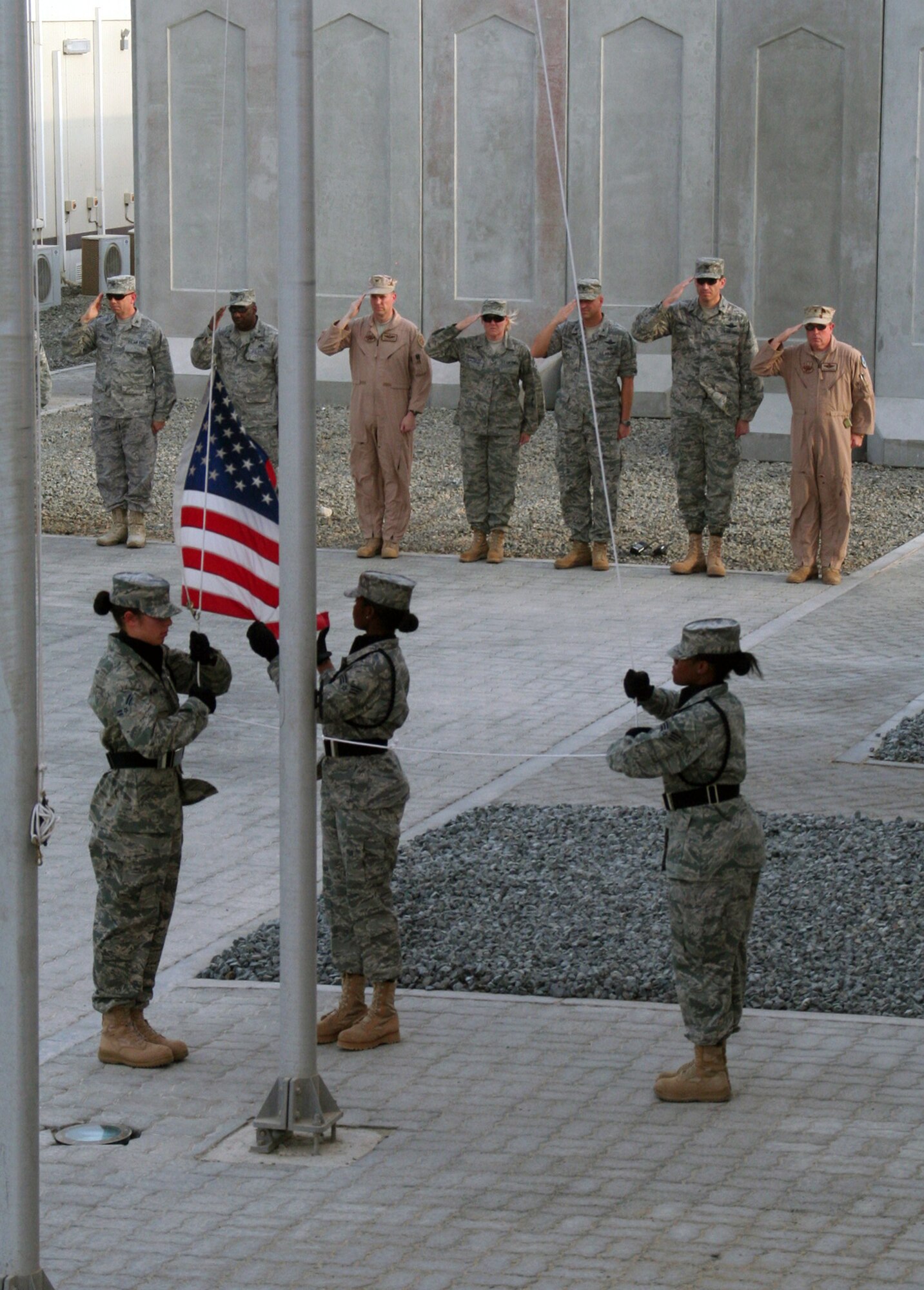 Airmen from the 380th Air Expeditionary Wing participate in a wing-wide retreat ceremony at a non-disclosed base in Southwest Asia on June 11, 2010. Every week the 380th AEW holds a retreat ceremony to honor the American flag and as part of a military tradition. During the June 11 ceremony, the 380th Expeditionary Operations Group served as the lead unit in formation. The 380th AEW supports operations Iraqi Freedom and Enduring Freedom and the Combined Joint Task Force-Horn of Africa. (U.S. Air Force Photo/Master Sgt. Scott T. Sturkol/Released)