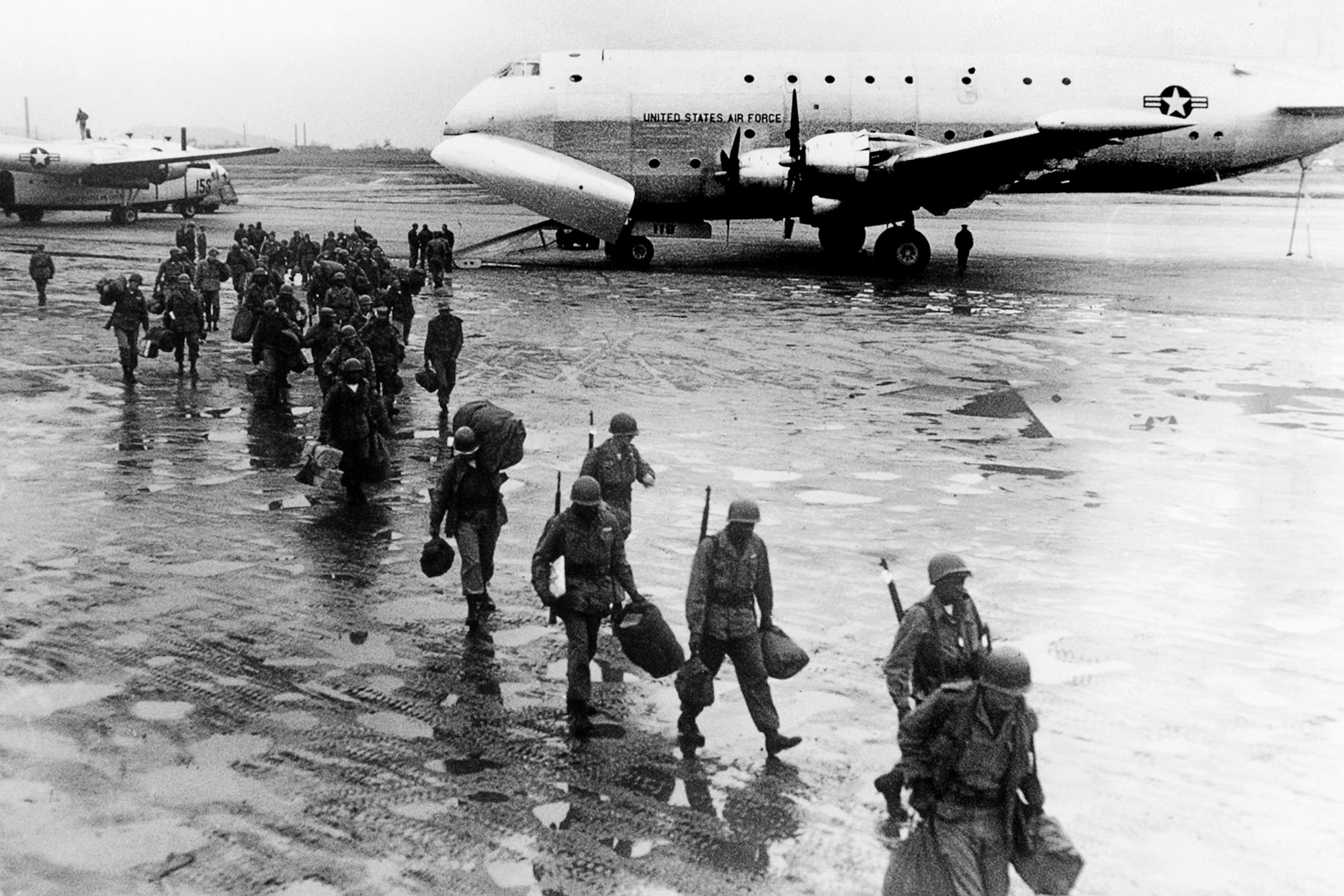 Soldiers return to Korea from a much needed five-day rest in Japan, transported aboard a USAF C-124. (U.S. Air Force photo)