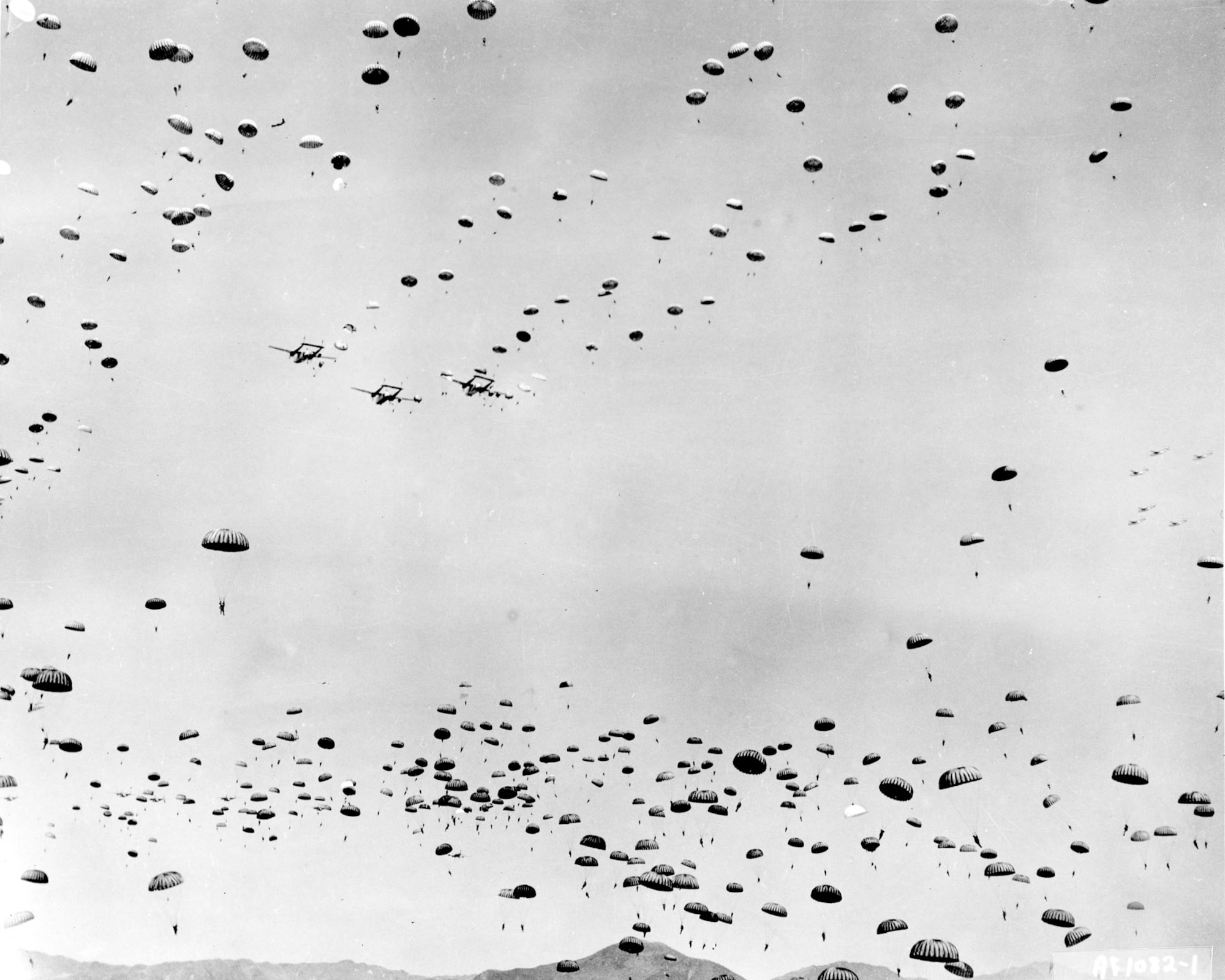 C-119s drop soldiers of the 187th Regimental Combat Team and will later supply them with food, vehicles, artillery and ammunition. (U.S. Air Force photo)