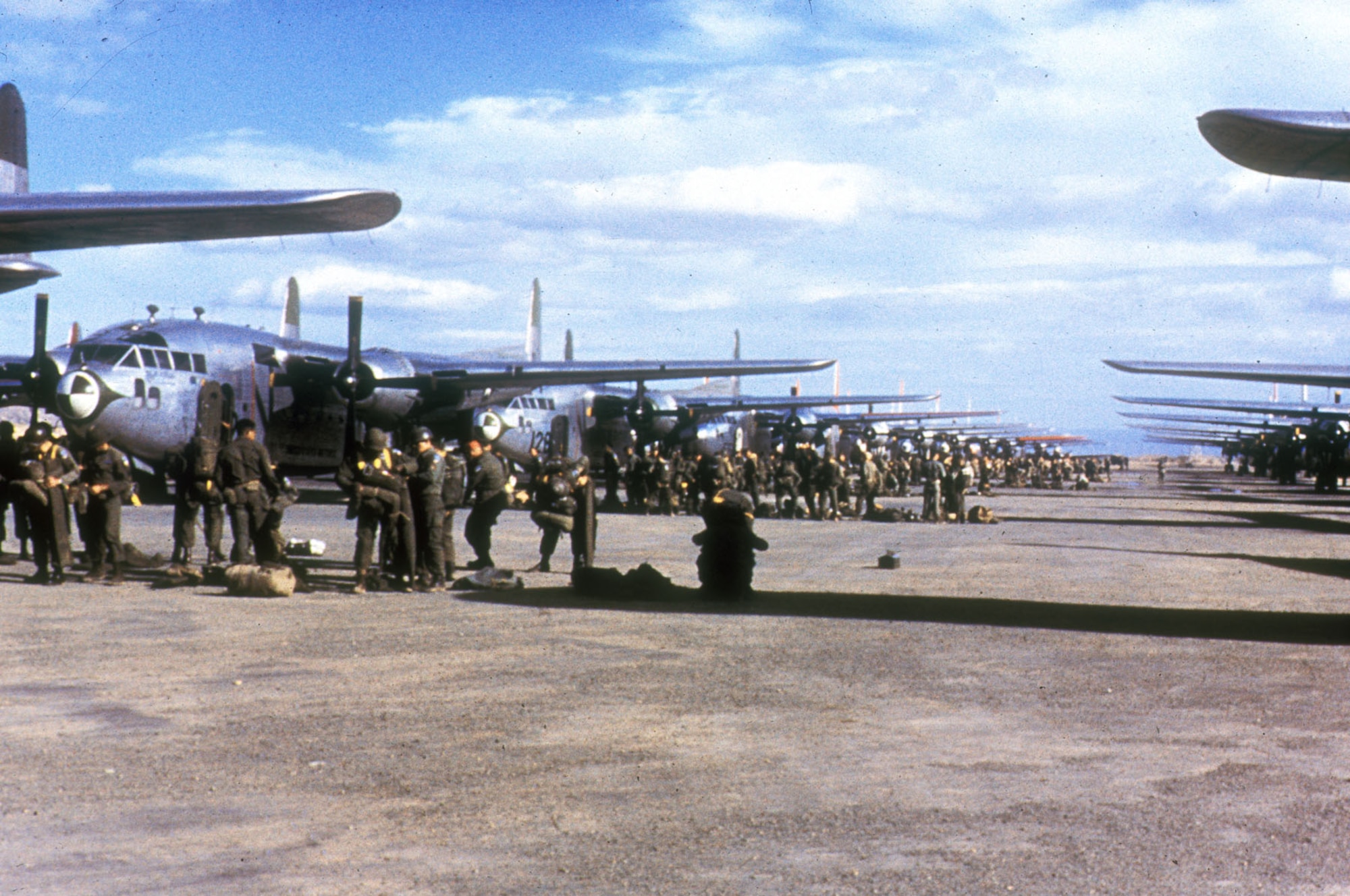 Army paratroopers prepare for an airdrop by USAF C-119 Combat Cargo Command aircraft. (U.S. Air Force photo)