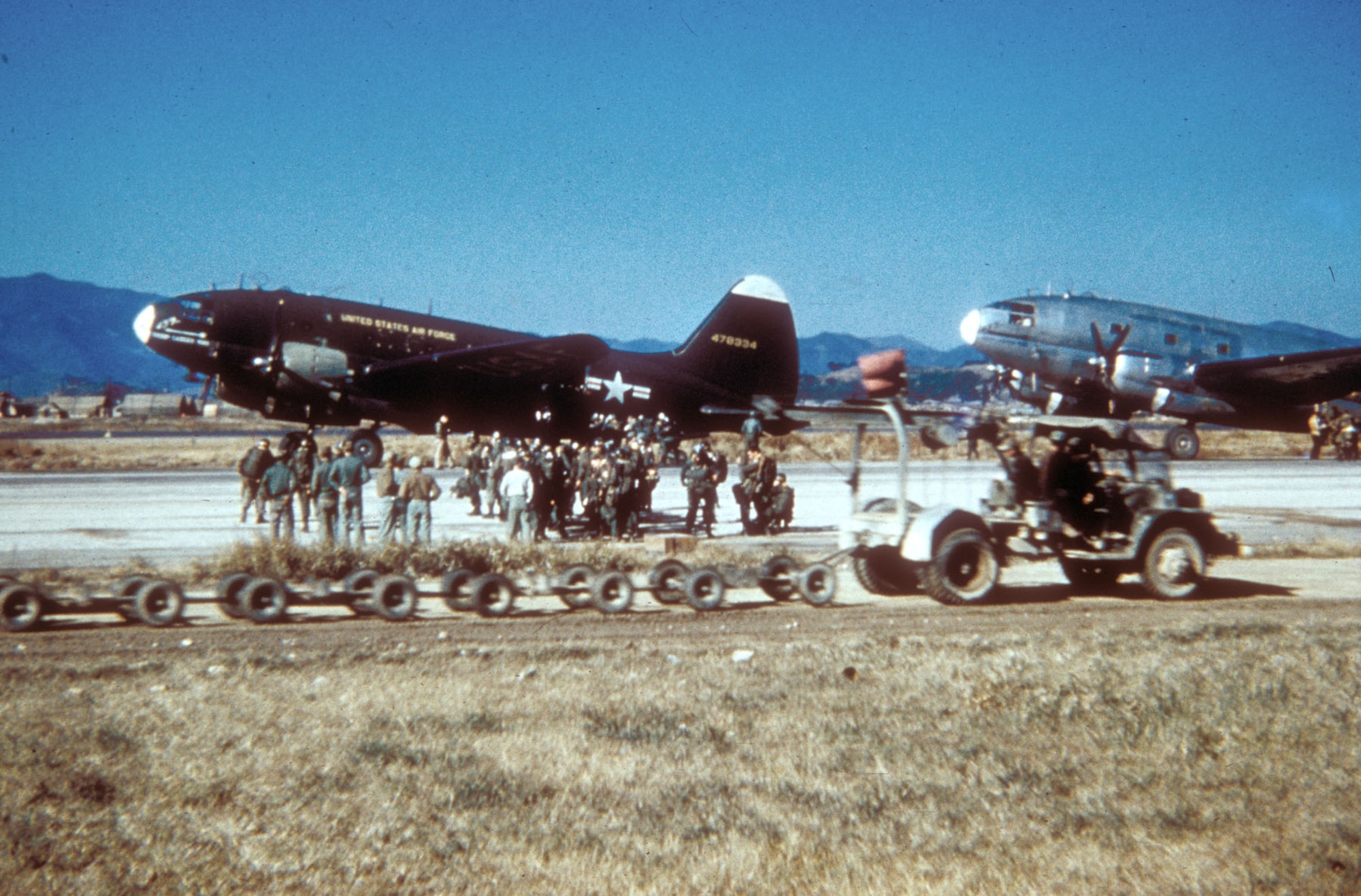 The World War II-era C-46 continued in service in Korea, where it airlanded supplies and supplemented C-119s during paratroop drops. (U.S. Air Force photo)