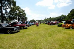 Families and spectators observed more than 90 cars and trucks that ranged from classic to modern day racers at a car show at Joint Base Charleston, S.C., June 12, 2010. The car show was held in conjunction with base picnic festivities. It was estimated that roughly 1,600 attendees enjoyed the sun, food and games the picnic had to offer. (U.S. Air Force Photo/Airman 1st Class Lauren Main)