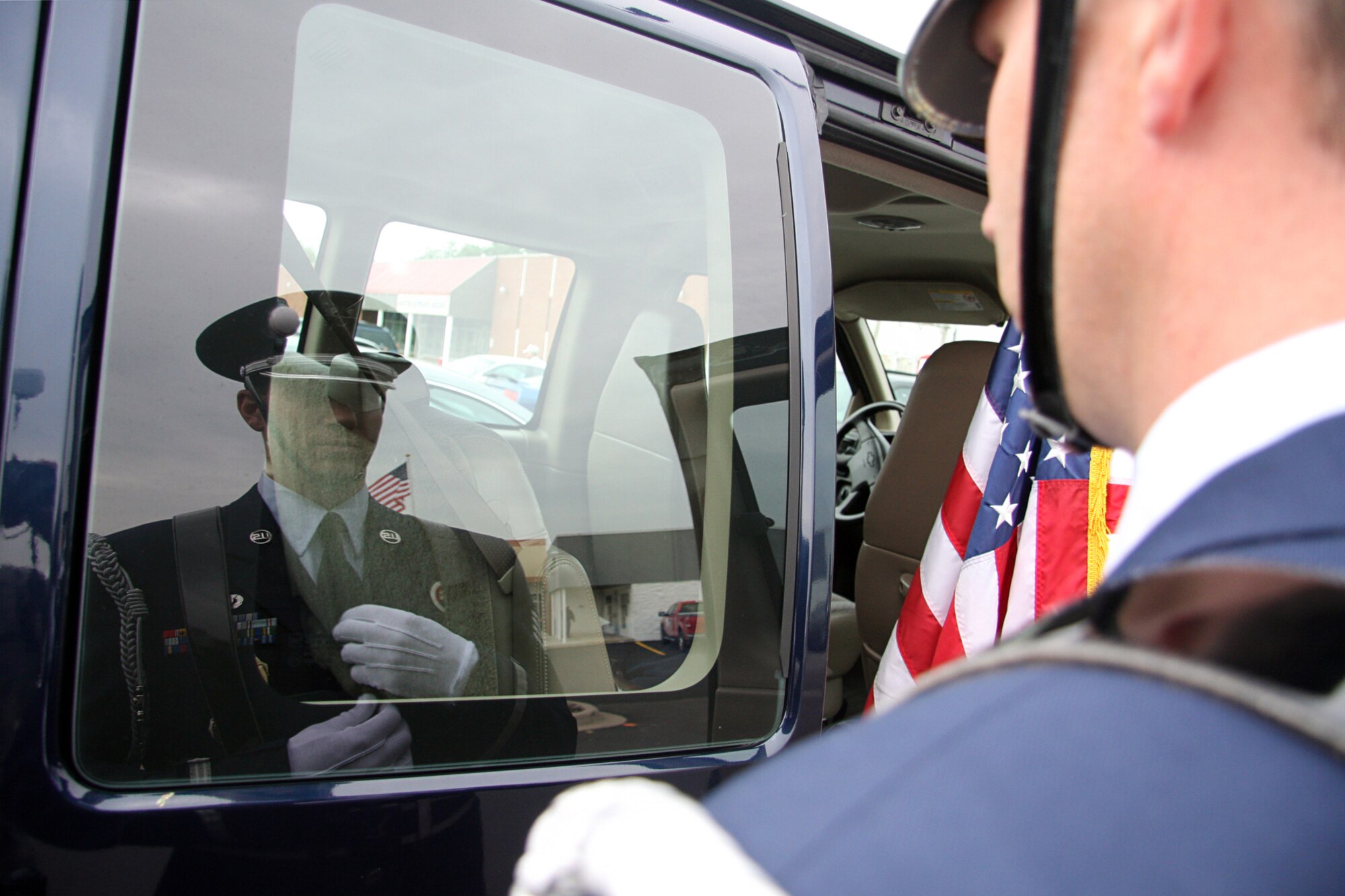 GRISSOM AIR RESERVE BASE, Ind. -- Staff Sgt. Ben Durr uses his reflection in the window of a van to make sure his ceremonial uniform is properly worn. Sergeant Durr is a member of the Grissom Base Honor Guard and was preparing to present the Colors at a opening ceremony for a new Veteran's Affairs clinic in Peru, Ind., June 8. Honor guard members pay special attention to their uniforms as they represent the United States Air Force and Grissom in the community. Sergeant Durr is a member of the 434th Security Forces Squadron. (U.S. Air Force photo/Tech. Sgt. Mark R. W. Orders-Woempner)