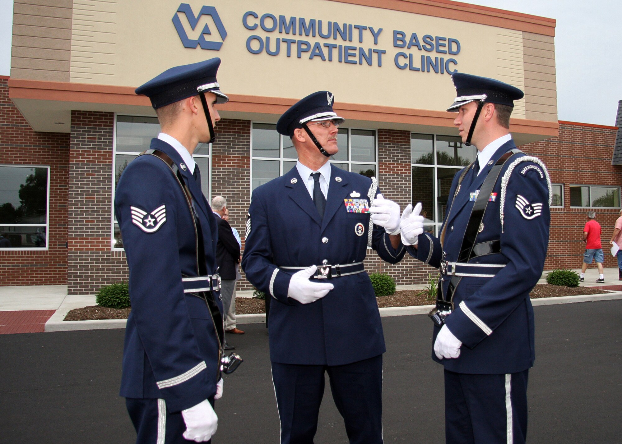 GRISSOM AIR RESERVE BASE, Ind. -- From left to right, Staff Sgt. Anthony Abney, Master Sgt. Tim Wood and Staff Sgt. Ben Durr, all members of the Grissom Base Honor Guard, go over how they will present the Colors at opening ceremonies for a new Veteran's Affairs clinic  in Peru, Ind., June 8. Base honor guard details often show up more than one hour prior to an event to plan and practice in order to execute their duty perfectly. (U.S. Air Force photo/Tech. Sgt. Mark R. W. Orders-Woempner)