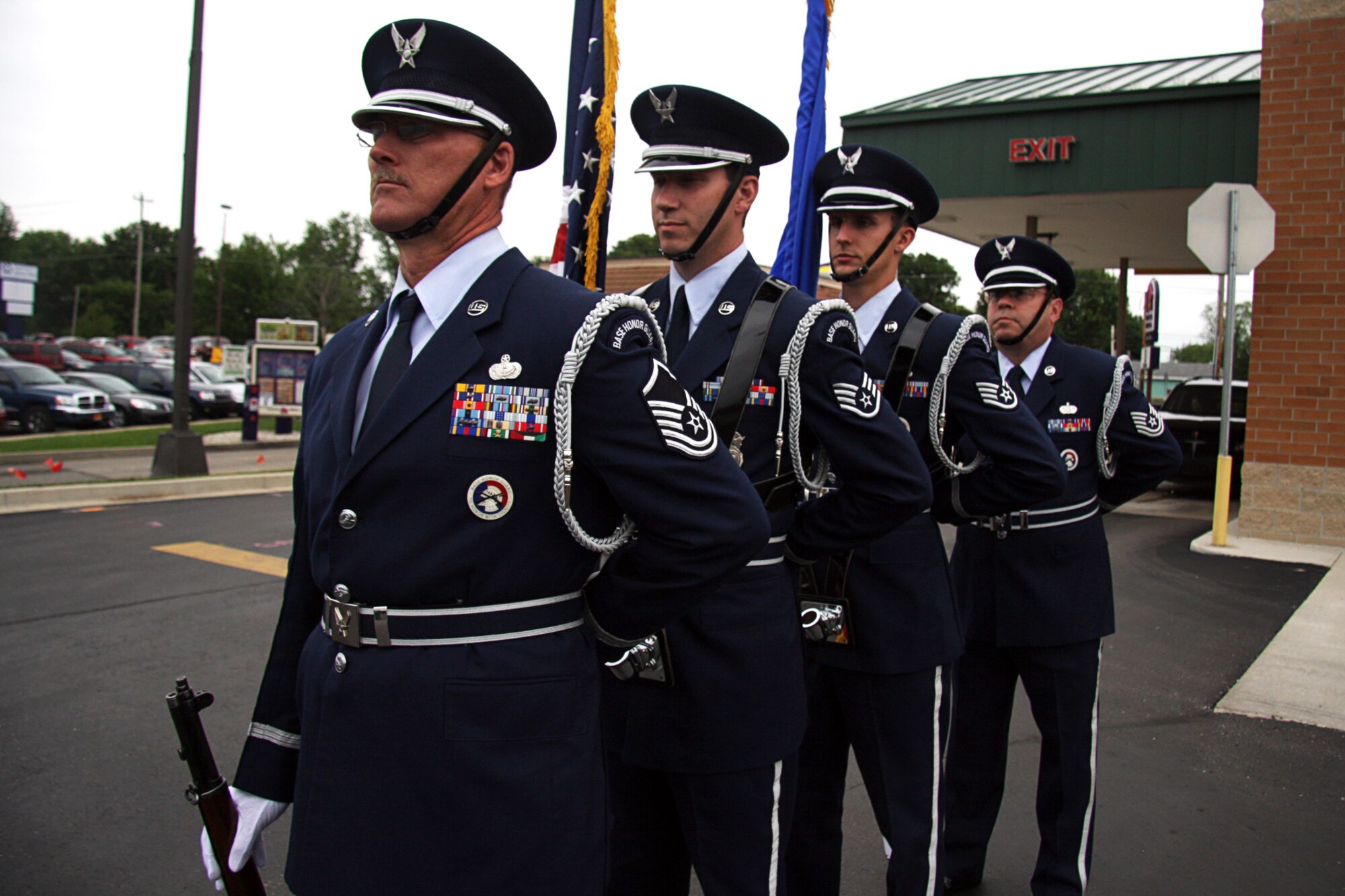 GRISSOM AIR RESERVE BASE, Ind. -- In a parking lot adjacent to a new Veteran's Affairs outpatient clinic in Peru, Ind., members of the Grissom Base Honor Guard rehearse a presenting the Colors ceremony June 8. From left to right are Master Sgt. Tim Wood, Staff Sgt. Ben Durr, Staff Sgt. Anthony Abney and Tech. Sgt. David Kirk. Typically, base honor guard details will arrive at a scheduled event one hour prior to plan and practice, making sure each movement is performed with exacting precision. (U.S. Air Force photo/Tech. Sgt. Mark R. W. Orders-Woempner)