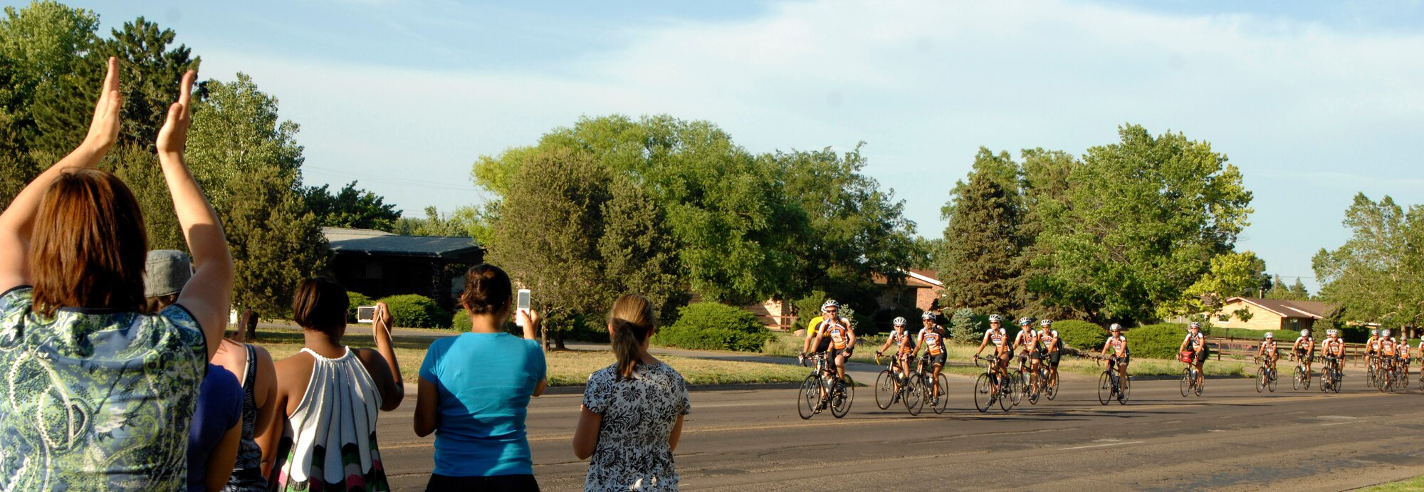 Cannon family members welcome Texas 4000 riders as they arrive for the evening in Clovis, N.M. Air Commandos who live in the city opened their doors to the bicyclists and provided them a comfortable accommodations for the evening. The riders are heading to Anchorage, Alaska, in a trek to raise money to combat cancer. (U.S. Air Force photo by Greg Allen)