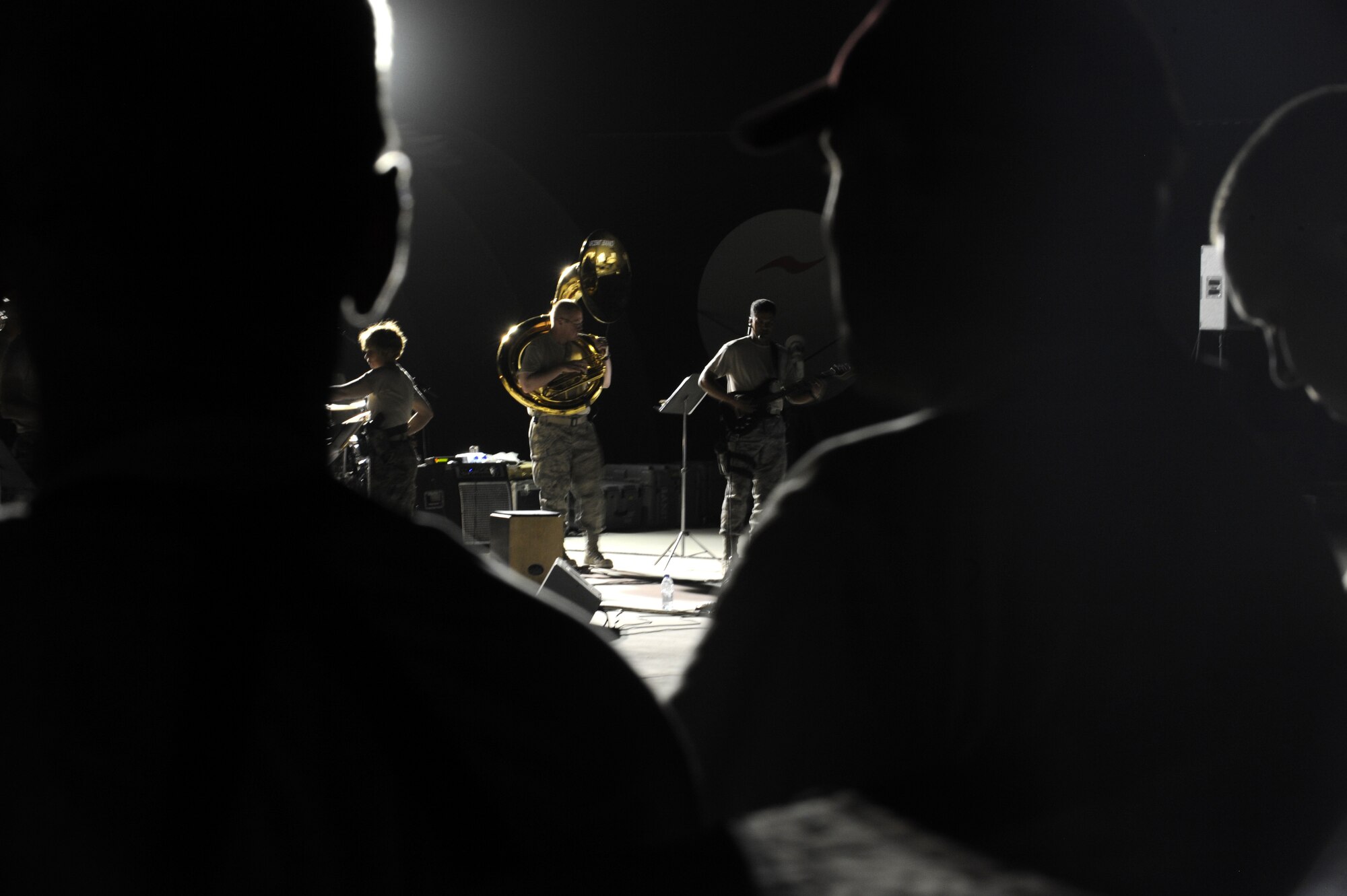 The 809th RED HORSE Squadron listens to a performance by the U.S. Air Forces Central Command Band at Kandahar Airfield, Afghanistan May 5.  These musicians tour all around the AOR to provide an ease to the atmosphere.  (U.S. Air Force photo by Senior Airman Nancy Hooks/Released)