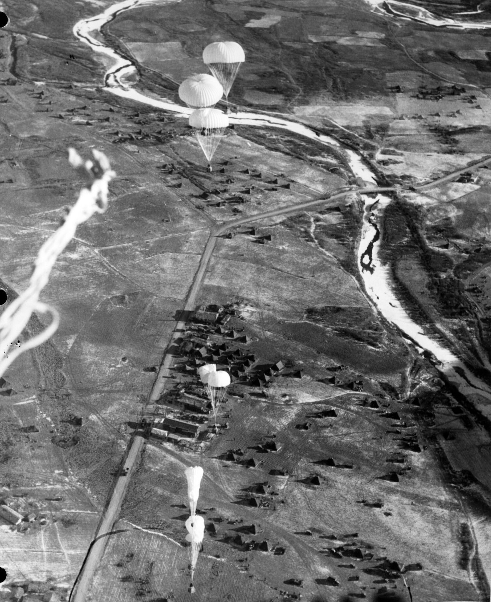 Airdropped supplies descend to U.S. and allied troops. Aerial resupply was critical in Korea, and Combat Cargo refined its techniques throughout the war. (U.S. Air Force photo)