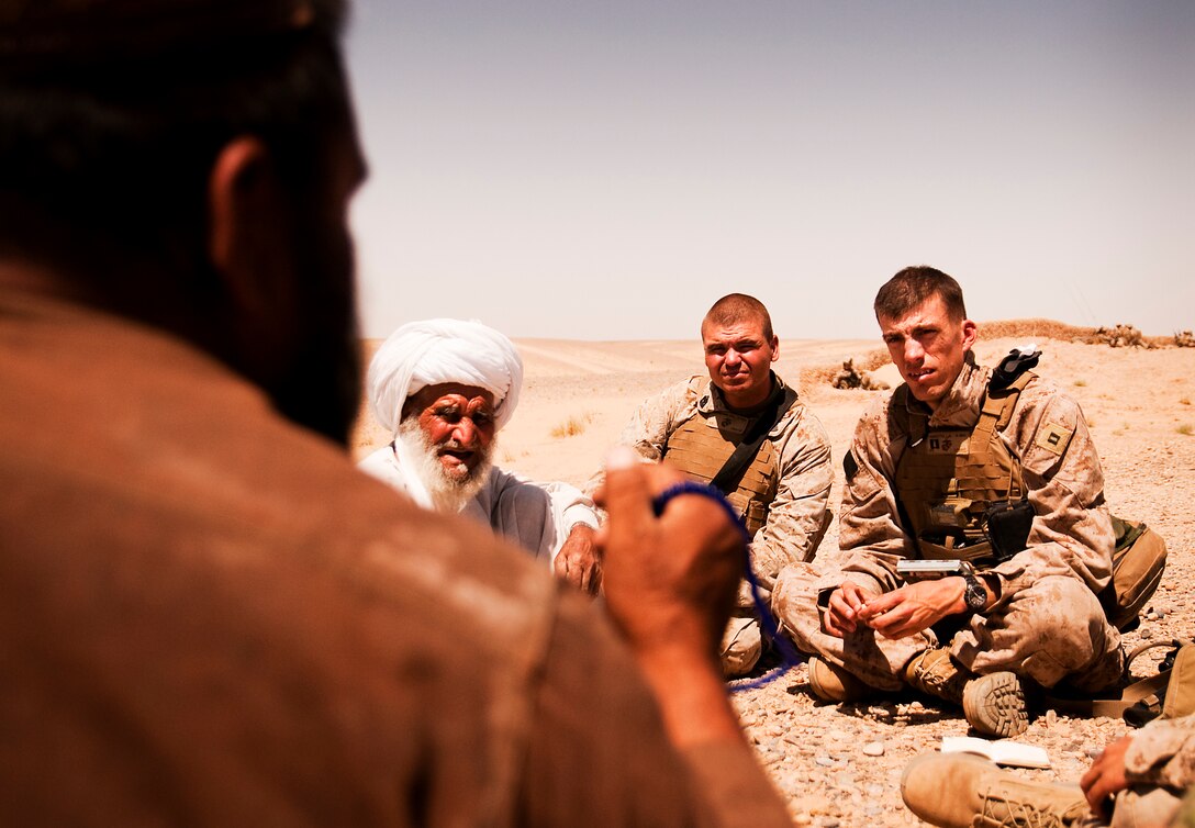 First Sgt. Wesley L. Misenhimer and Capt. Luke Pernotto, the first sergeant and commanding officer of Lima Company, 3rd Battalion, 3rd Marine Regiment, listen to the concerns of local elders in Southern Shorshork, Helmand province, Afghanistan, during Operation Cobra, June 17. Operation Cobra is a joint operation between Marine Corps units and the Afghanistan National Army to disrupt enemy forces which have been using the sparsely populated region between Marjah and Nawa as a safe haven.