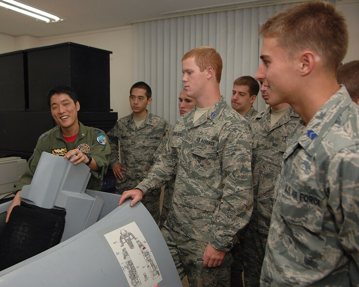 KUNSAN AIR BASE, Republic of Korea -- Capt. Yang Woon Jung, 38th Fighter Group, gives U.S. Air Force Academy and Air Force Reserve Officers’ Training Corps cadets a tour of the 38th Fighter Group during an Operation Air Force program visit here June 11. Operation Air Force is a three-week summer course given to USAFA and ROTC cadets to expose the cadets to the real operational Air Force.  (U.S. Air Force photo/Courtesy Photo)
