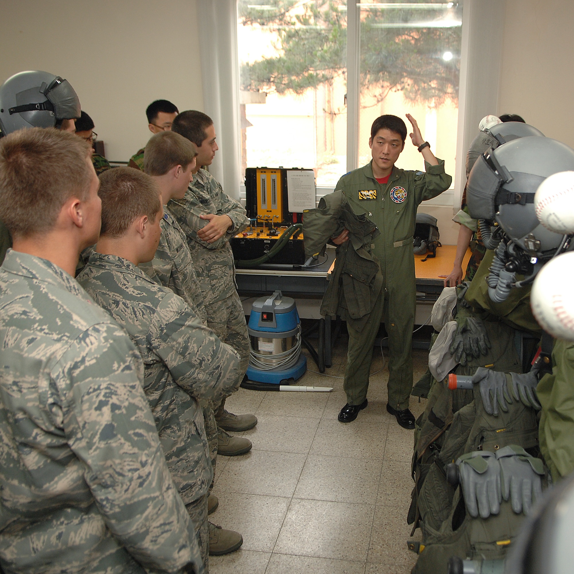 KUNSAN AIR BASE, Republic of Korea -- Capt. Yang Woon Jung, 38th Fighter Group, gives U.S. Air Force Academy and Air Force Reserve Officers’ Training Corps cadets a tour of the 38th Fighter Group during an Operation Air Force program visit here June 11. Operation Air Force is a three-week summer course given to USAFA and ROTC cadets to expose the cadets to the real operational Air Force.  (U.S. Air Force photo/Courtesy Photo)
