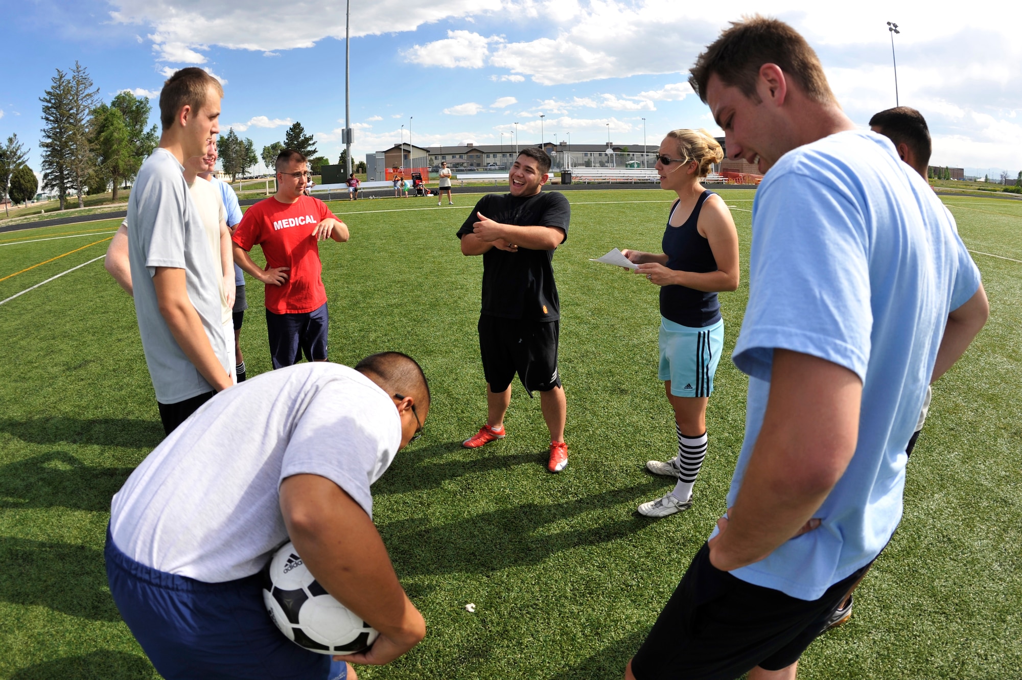 BUCKLEY AIR FORCE BASE, Colo. --  Prospective intramural soccer players huddle up for team planning June 16. (U.S. Air Force photo by Airman 1st Class Paul Labbe)