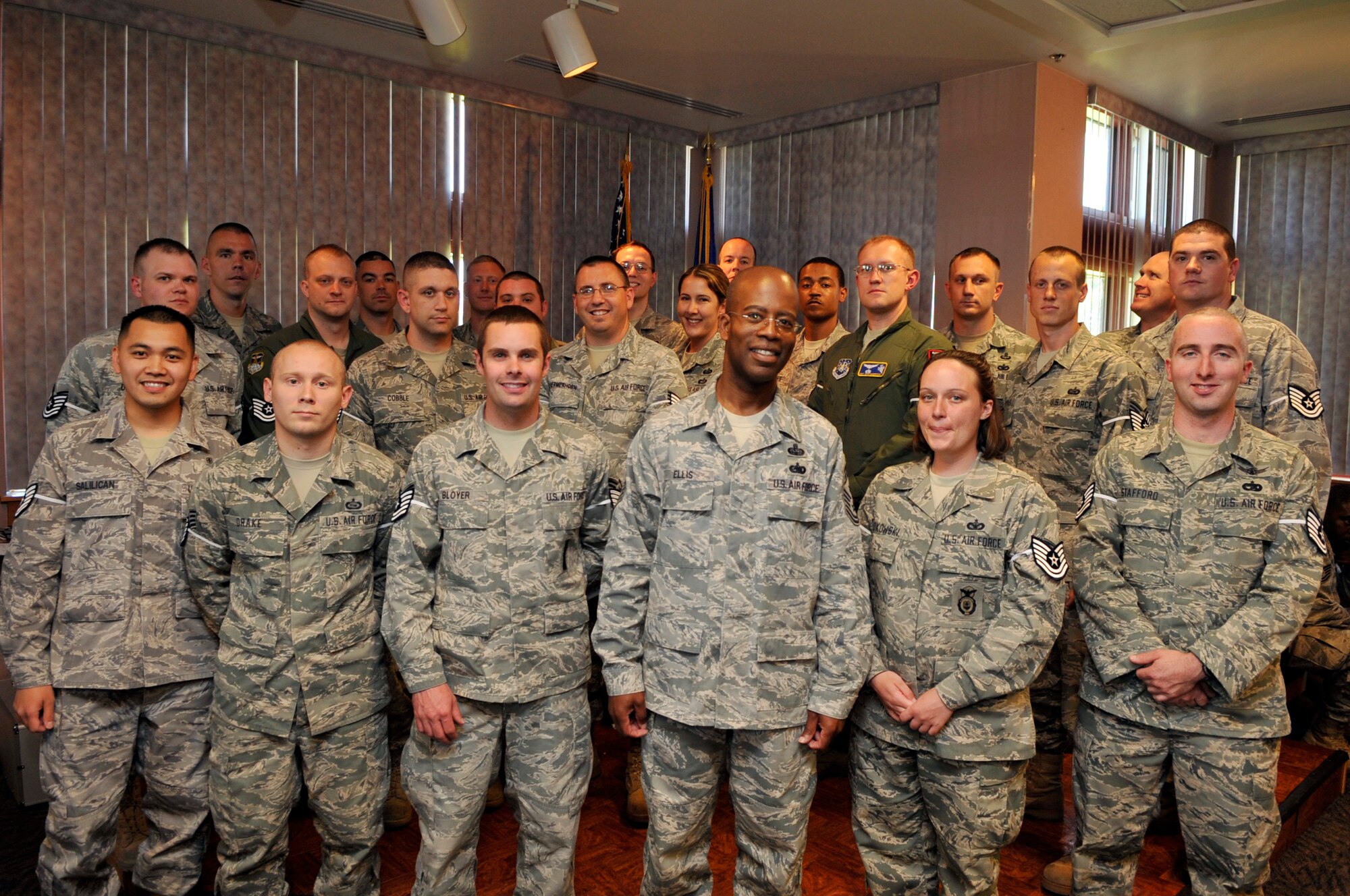 BUCKLEY AIR FORCE BASE, Colo. -- Team Buckley's newest technical sergeant selectees pause for celebration with Chief Master Sgt. Robert Ellis, 460th Space Wing command chief, June 17. 37 staff sergeants from Buckley Air Force Base were selected for promotion. (U.S. Air Force photo by Airman 1st Class Paul Labbe)