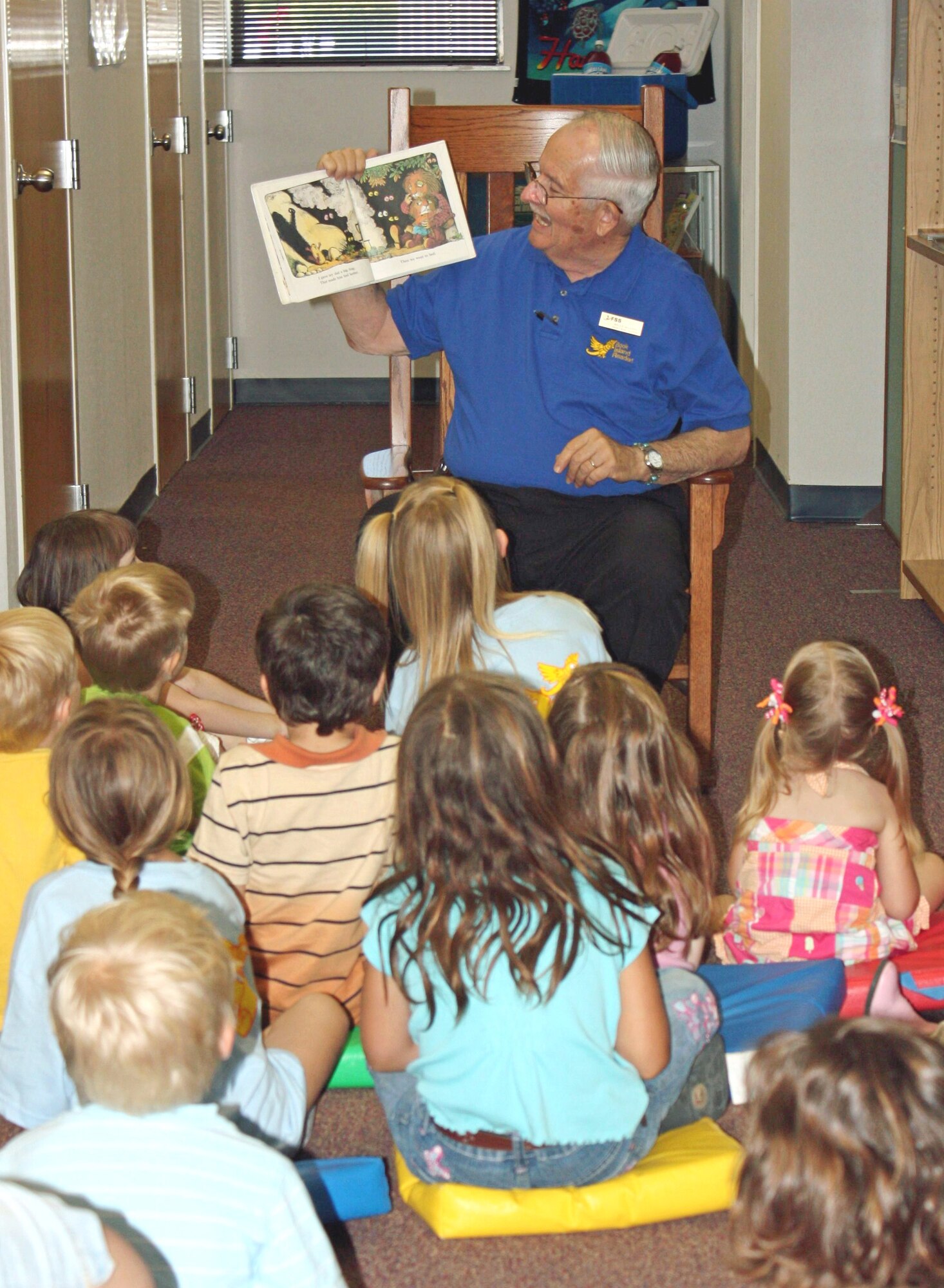 Malcolm McLaren, Goodfellow librarian, reads to a group of Voyage to Book Island participants at the base library June 9. There are more than 100 youths here signed up for the Department of Defense-wide summer reading program. To register, contact Mr. McLaren at 325-654-3045. (U.S. Air Force photo/Brian Thorn)