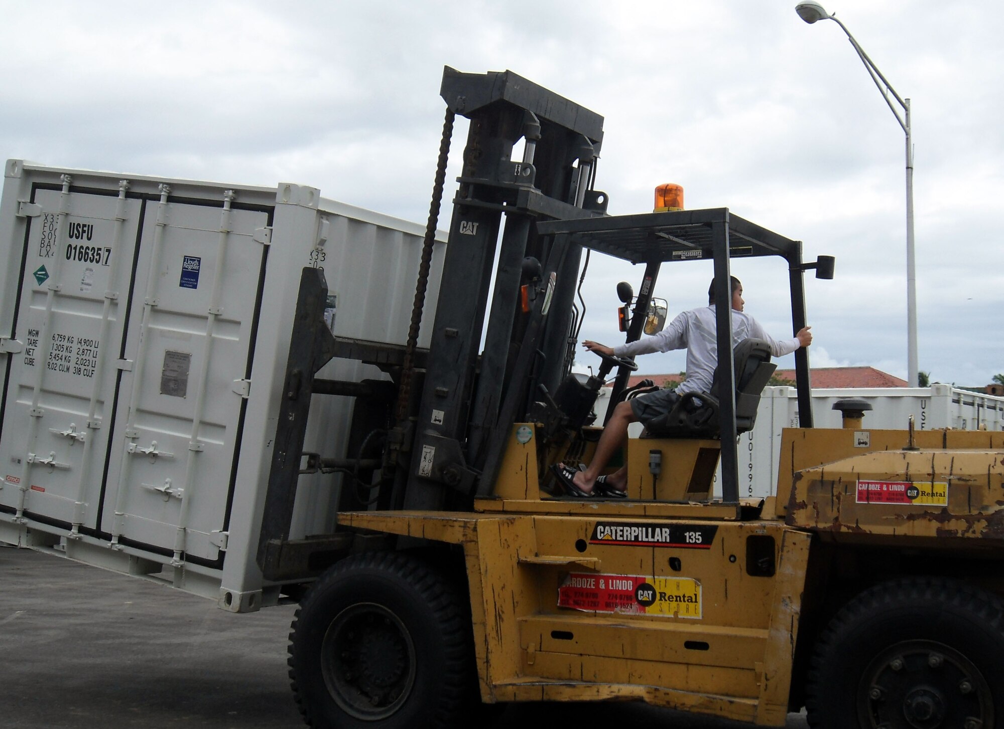 Airmen load the first shipment of materiel for New Horizons Panama 2010 onto trucks in Panama City. New Horizons Panama 2010 is a 12-week humanitarian assistance mission. More than 250 Airmen, Soldiers and Marines will deploy to six constructions sites and five medical missions in Panama. (U.S. Air Force photo/Staff Sgt. Teresa Burger)