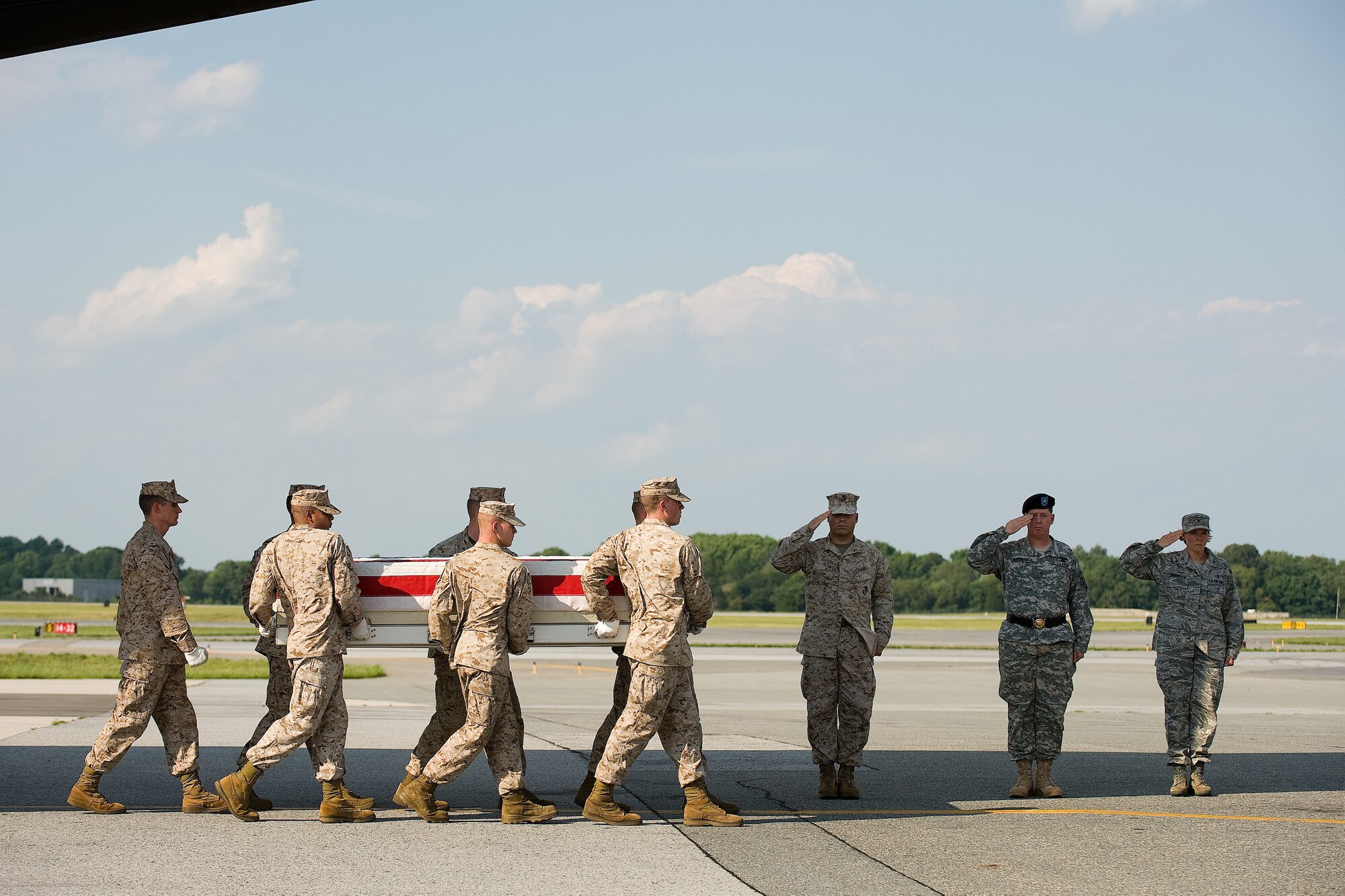 10 June 2010  USAF Photo by Jason Minto.  A U.S. Marine Corps carry team transfers the remains of Marine SGT Zachary J. Walters of Palm Coast, FL., at Dover Air Force Base, Del., June 10, 2010.  