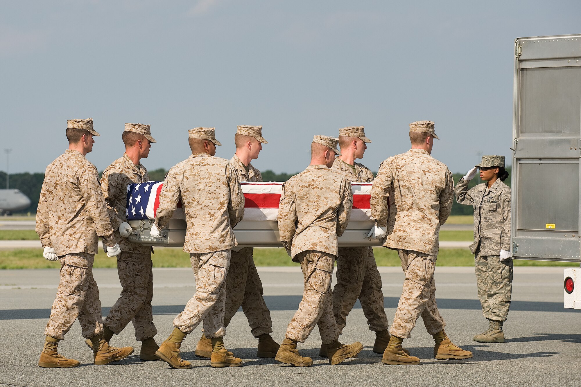 10 June 2010  USAF Photo by Jason Minto.  A U.S. Marine Corps carry team transfers the remains of Marine SGT Derek Shanfield of Hastings, PA., at Dover Air Force Base, Del., June 10, 2010.  