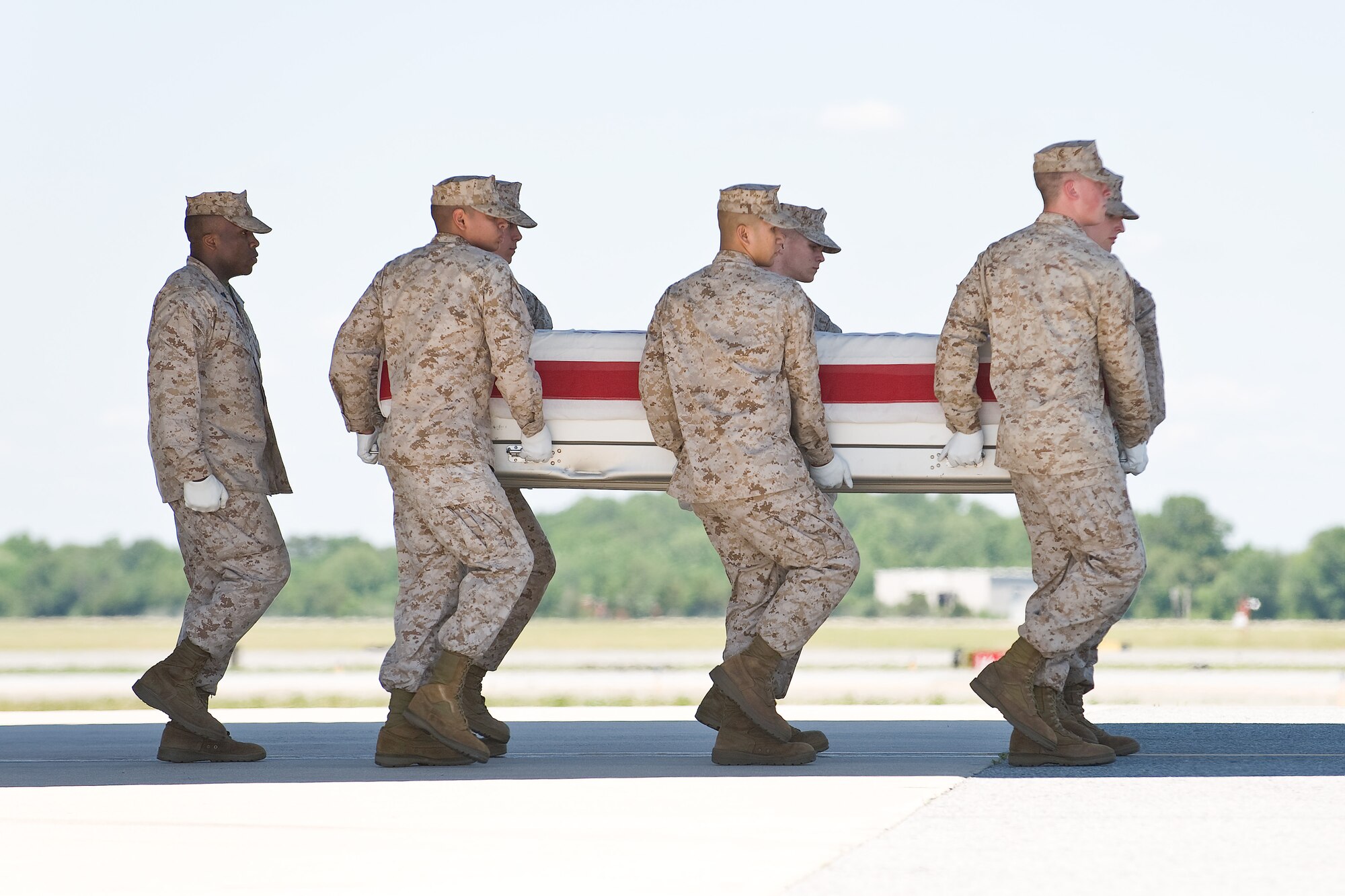 A U.S. Marine Corps team transfers the remains of Marine Corps Cpl. Donald M. Marler, of St. Louis, Mo., at Dover Air Force Base, Del., June 8. Cpl. Marler was assigned to 3rd Battalion, 1st Marine Regiment, 1st Marine Division, I Marine Expeditionary Force, Camp Pendleton, Calif. (U.S. Air Force photo/Roland Balik)