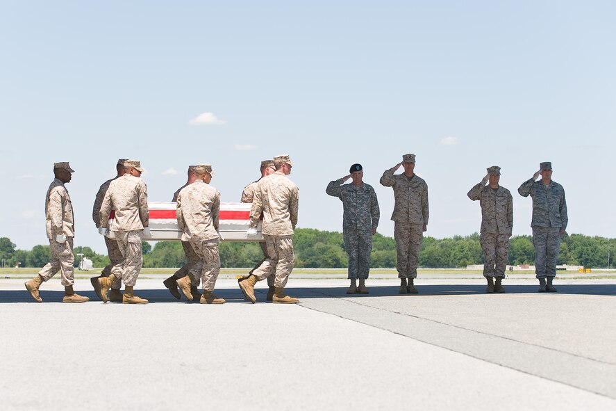 A U.S. Marine Corps team transfers the remains of Marine Corps Lance Cpl. Derek Hernandez, of Edinburg, Texas, at Dover Air Force Base, Del., June 8. Lance Cpl. Hernandez was assigned to 3rd Battalion, 1st Marine Regiment, 1st Marine Division, I Marine Expeditionary Force, Camp Pendleton, Calif. (U.S. Air Force photo/Roland Balik)