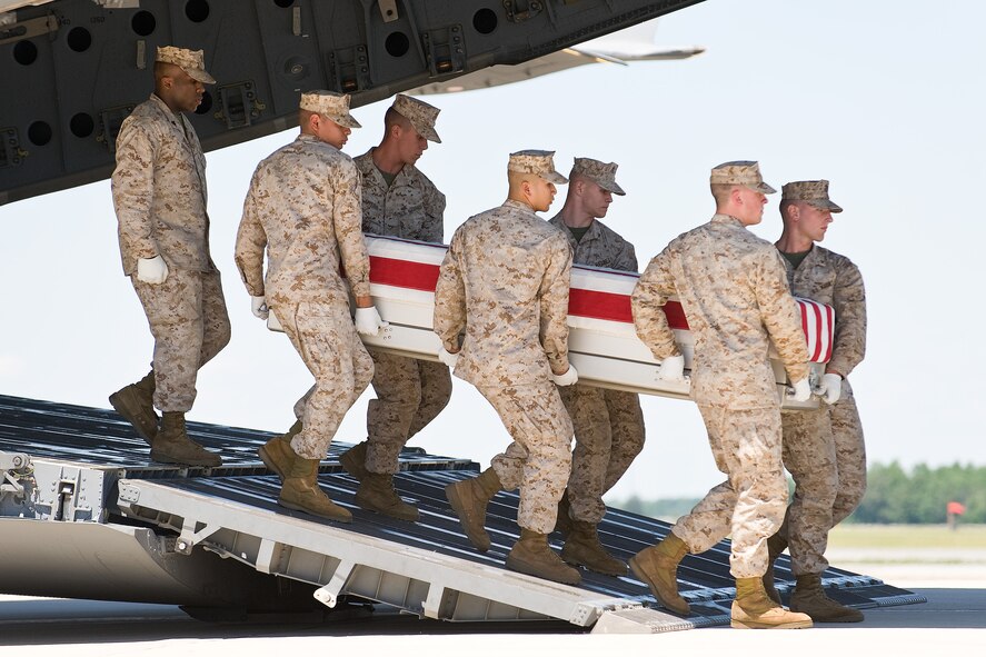 A U.S. Marine Corps team transfers the remains of Marine Corps Sgt. Brandon C. Bury, of Kingwood, Texas, at Dover Air Force Base, Del., June 8. Sgt. Bury was assigned to 3rd Battalion, 1st Marine Regiment, 1st Marine Division, I Marine Expeditionary Force, Camp Pendleton, Calif. (U.S. Air Force photo/Roland Balik)