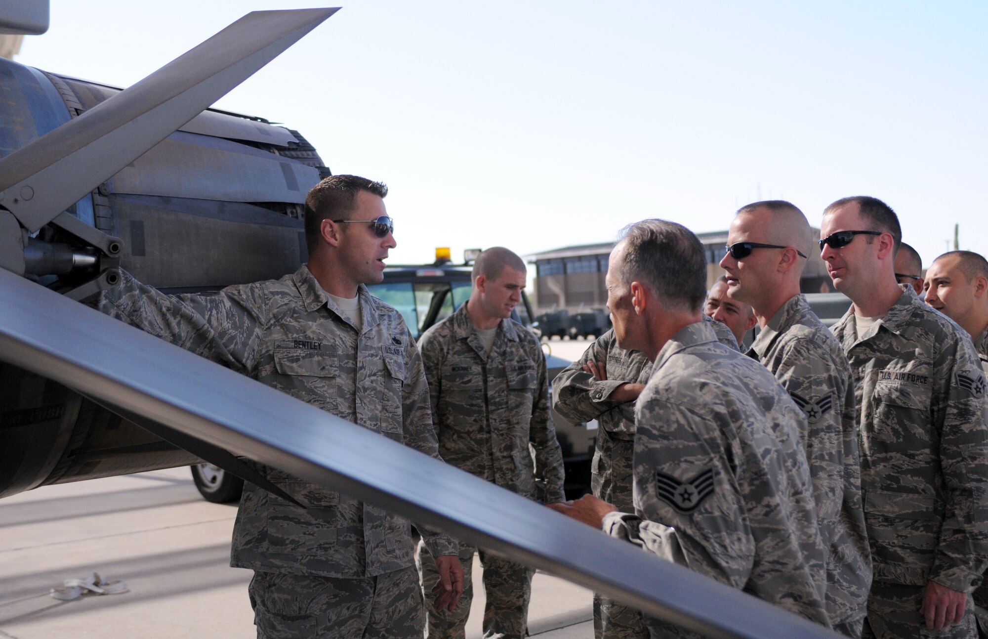 Tech. Sgt. Jeff Bentley, an instructor with the Tucson Aircraft Maintenance School, shows students around an F-16 Fighting Falcon on the Davis-Monthan Air Force Base flightline June 15. The first eight students to attend the school will graduate Aug. 17 as crew chiefs for their respective Air National Guard fighter units. The new school, operated by Arizona’s 162nd Fighter Wing, will allow more Guardsmen to receive necessary training in a timely manner. (Air Force photo by Maj. Gabe Johnson)