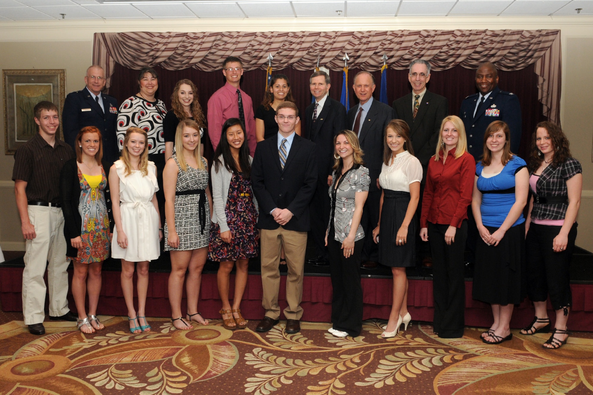 The 14 recipients of the Tinker Officers’ Spouse Club scholarships pose with Maj. Gen. David Gillett, Oklahoma City Air Logistics Center commander, top row left; OSC President Laura Fulton, second from left, top row; Michael Kloiber, president of Tinker Federal Credit Union, center, top row; representatives of First Command and Col. Allen Jamerson, 72nd Air Base Wing commander, far right, top row. (Courtesy photo)
