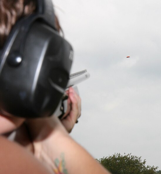 Katherine Nobile takes aim at a clay pigeon recently during a shoot day with the Tinker Shooting Club. Nobile, an England native, came to the sport of shooting after marrying her husband J.W., who works at Tinker. The two are members of the shooting club which is open to new members. (Air Force photos by John Stuart)
