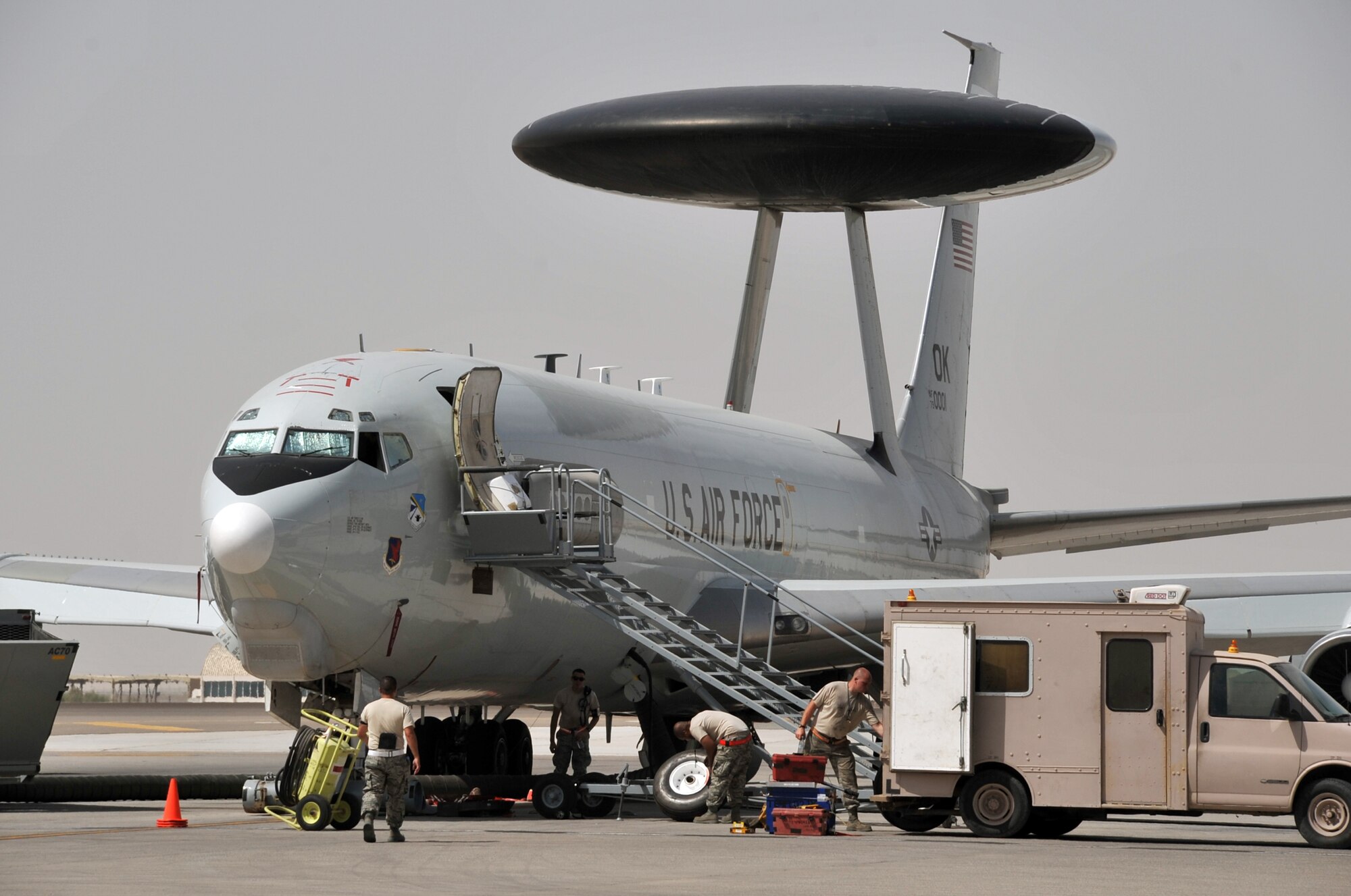Maintenance Airmen from the 380th Expeditionary Aircraft Maintenance Squadron's Sentry aircraft maintenance unit work on an E-3 Sentry Airborne Warning and Control System aircraft on the flightline for the 380th Air Expeditionary Wing at a non-disclosed base in Southwest Asia on June 2, 2010. The E-3 Sentry aircraft and the Airmen who support and fly them are deployed from Tinker Air Force Base, Okla. The E-3 aircraft are assigned to the 963rd Expeditionary Airborne Air Control Squadron. The 380th AEW is home to the KC-10 Extender, U-2 Dragonlady, E-3 Sentry and RQ-4 Global Hawk aircraft. The wing is comprised of five groups and 18 squadrons and the wing's deployed mission includes air refueling, air battle management, surveillance, and reconnaissance in support of overseas contingency operations in Southwest Asia. The 380th AEW supports operations Iraqi Freedom and Enduring Freedom and the Combined Joint Task Force-Horn of Africa. (U.S. Air Force Photo/Master Sgt. Scott T. Sturkol/Released)
