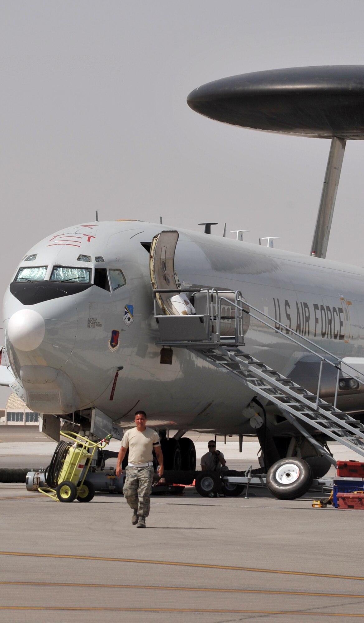 Maintenance Airmen from the 380th Expeditionary Aircraft Maintenance Squadron's Sentry aircraft maintenance unit work on an E-3 Sentry Airborne Warning and Control System aircraft on the flightline for the 380th Air Expeditionary Wing at a non-disclosed base in Southwest Asia on June 2, 2010. The E-3 Sentry aircraft and the Airmen who support and fly them are deployed from Tinker Air Force Base, Okla. The E-3 aircraft are assigned to the 963rd Expeditionary Airborne Air Control Squadron. The 380th AEW is home to the KC-10 Extender, U-2 Dragonlady, E-3 Sentry and RQ-4 Global Hawk aircraft. The wing is comprised of five groups and 18 squadrons and the wing's deployed mission includes air refueling, air battle management, surveillance, and reconnaissance in support of overseas contingency operations in Southwest Asia. The 380th AEW supports operations Iraqi Freedom and Enduring Freedom and the Combined Joint Task Force-Horn of Africa. (U.S. Air Force Photo/Master Sgt. Scott T. Sturkol/Released)