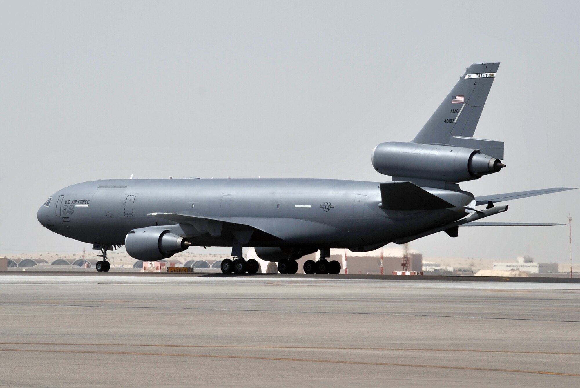 A flight crew from the 908th Expeditionary Air Refueling Squadron guides a KC-10 Extender, also from the 908th EARS, to a parking area at a non-disclosed base in Southwest Asia on June 2, 2010. According to statistics from Mr. Yancy Mailes, 380th AEW historian, KC-10s assigned to the 908th EARS and the Airmen who support and fly them flew more than 230 missions off-loading nearly 35 million pounds of fuel to more than 2,100 aircraft from January through April 2010. The 908th EARS, as part of the 380th Air Expeditionary Wing, supports operations Iraqi Freedom, Enduring Freedom, and the Combined Joint Task Force-Horn of Africa. The 908th EARS is a sub-unit of the 380th Air Expeditionary Wing. In addition to the KC-10 Extender, the 380th AEW is home to the U-2 Dragon Lady, E-3 Sentry and RQ-4 Global Hawk aircraft. The wing is comprised of four groups and 12 squadrons and the wing's deployed mission includes air refueling, surveillance and reconnaissance in support of overseas contingency operations in Southwest Asia. (U.S. Air Force Photo/Master Sgt. Scott T. Sturkol/Released)