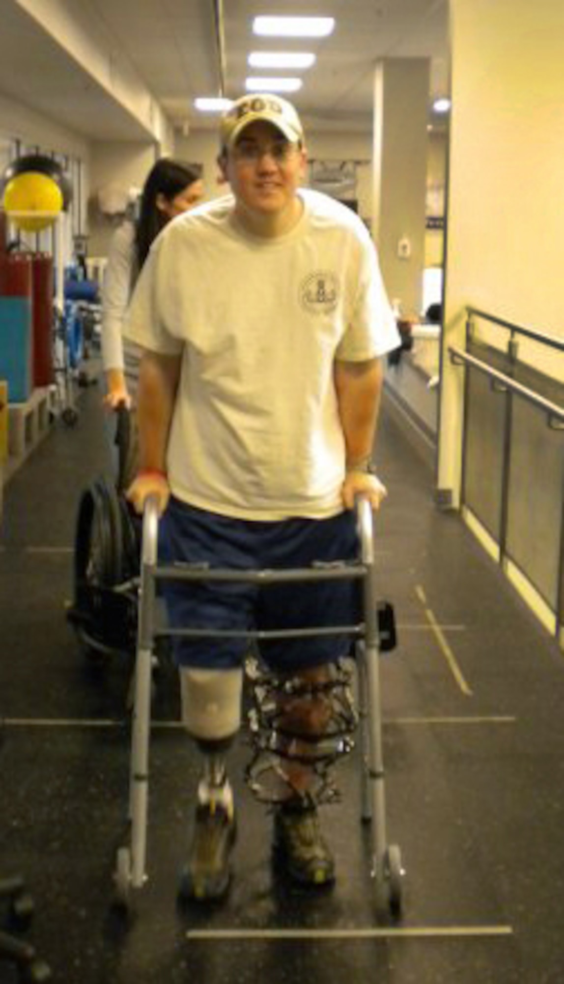WASHINGTON, D.C. -- Staff Sgt. David Flowers, an Explosive Ordnance Disposal technician from Barksdale, stops for a photo op during his rehabilitation at Walter Reed Medical Center in Washington, D.C.  Sergeant Flowers lost his right leg below the knee, completely shattered his left leg and fractured his right arm and wrist when he stepped on an anti-personnel land mine in Afghanistan on May 11, 2009. (COURTESY PHOTO). 