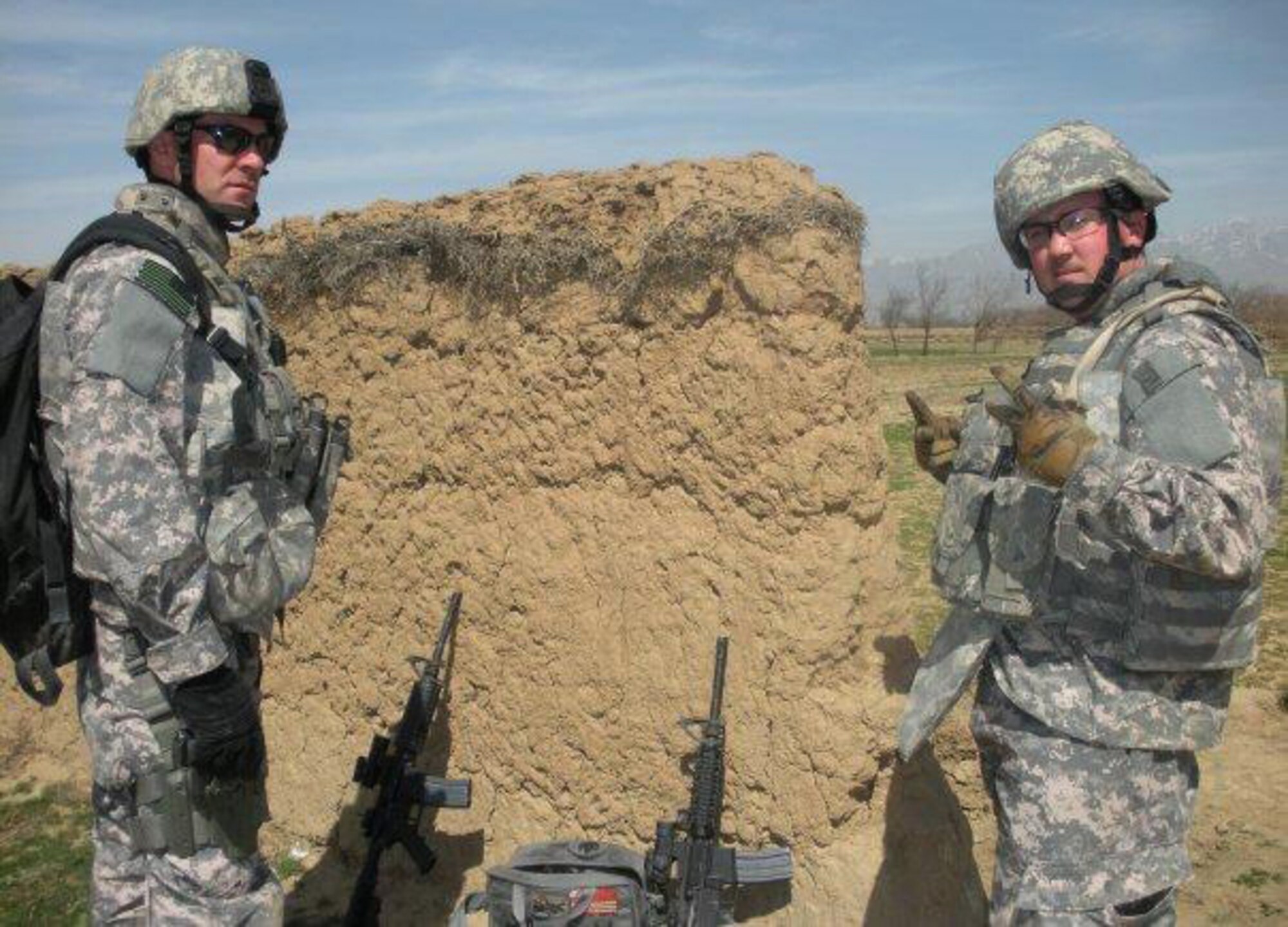 AFGHANISTAN -- Staff Sgt. David Flowers (right) and Staff Sgt. Gene Tschida, Explosive Ordnance Disposal technicians deployed with the 455th Air Expeditionary Wing at Bagram Airfield, Afghanistan, stop for a quick photo during their deployment in 2009. (COURTESY PHOTO). 