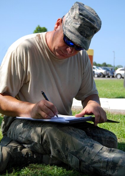 Air Force Reserve Tech Sgt. Joshua Watson, 919th Civil Engineer Squadron, draws up a design for a ramp to connect a deck project to a nearby sidewalk at Hurlburt Field, Fla.  Members of the Duke Field, Fla., squadron built the deck June 3-4 for the Children’s Learning Center as part of the “Nature Explore Classroom.” (U.S. Air Force photo/Tech. Sgt. Cheryl Foster)