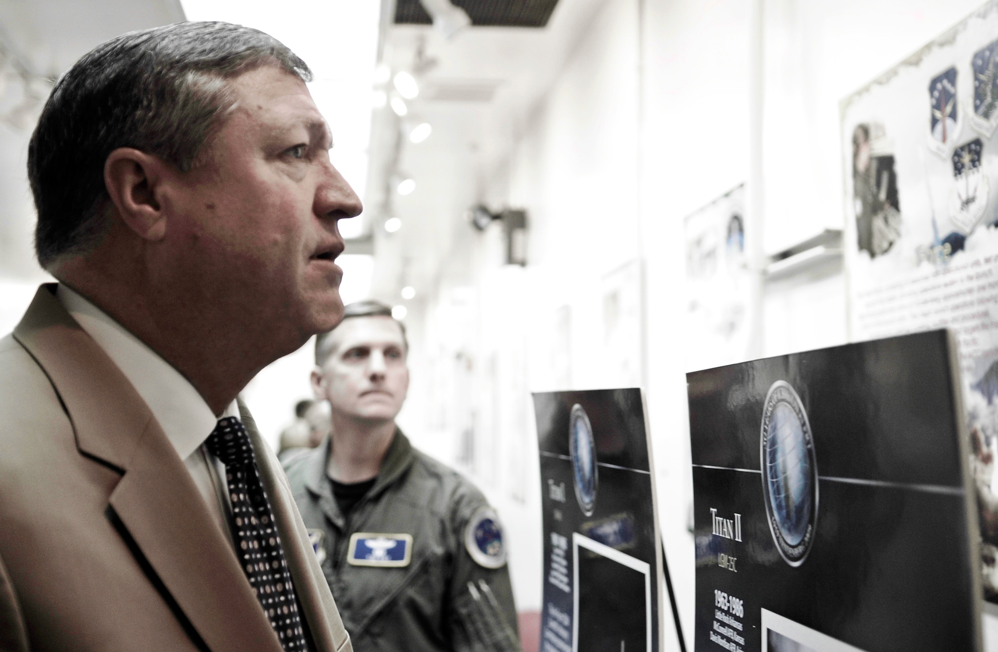 Secretary of the Air Force Michael Donley looks at a display featuring some of previous launches at Vandenberg Air Force Base, Calif., during a tour of base facilities June 15, 2010. During his visit, Secretary Donley met with base leadership, toured facilities and observed a Minuteman III launch, the first under Air Force Global Strike Command. (U.S. Air Force photo/Senior Airman Ashley Reed)
