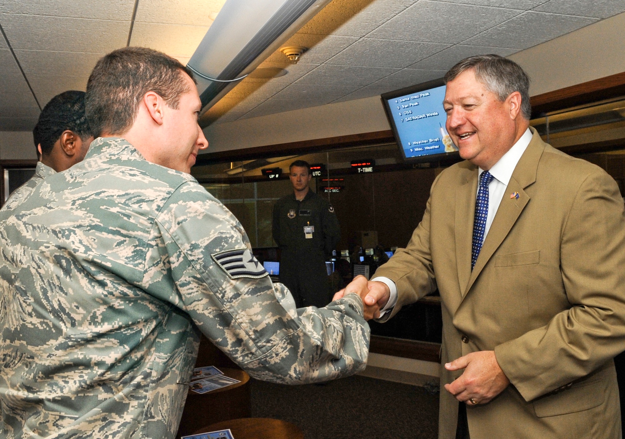 Secretary of the Air Force Michael Donley shakes hands with Airmen June 15, 2010, during a tour of the Vandenberg Air Force Base, Calif. During his visit, Secretary Donley met with base leadership, toured facilities and observed a Minuteman III launch, the first under Air Force Global Strike Command. (U.S. Air Force photo/Senior Airman Ashley Reed)
