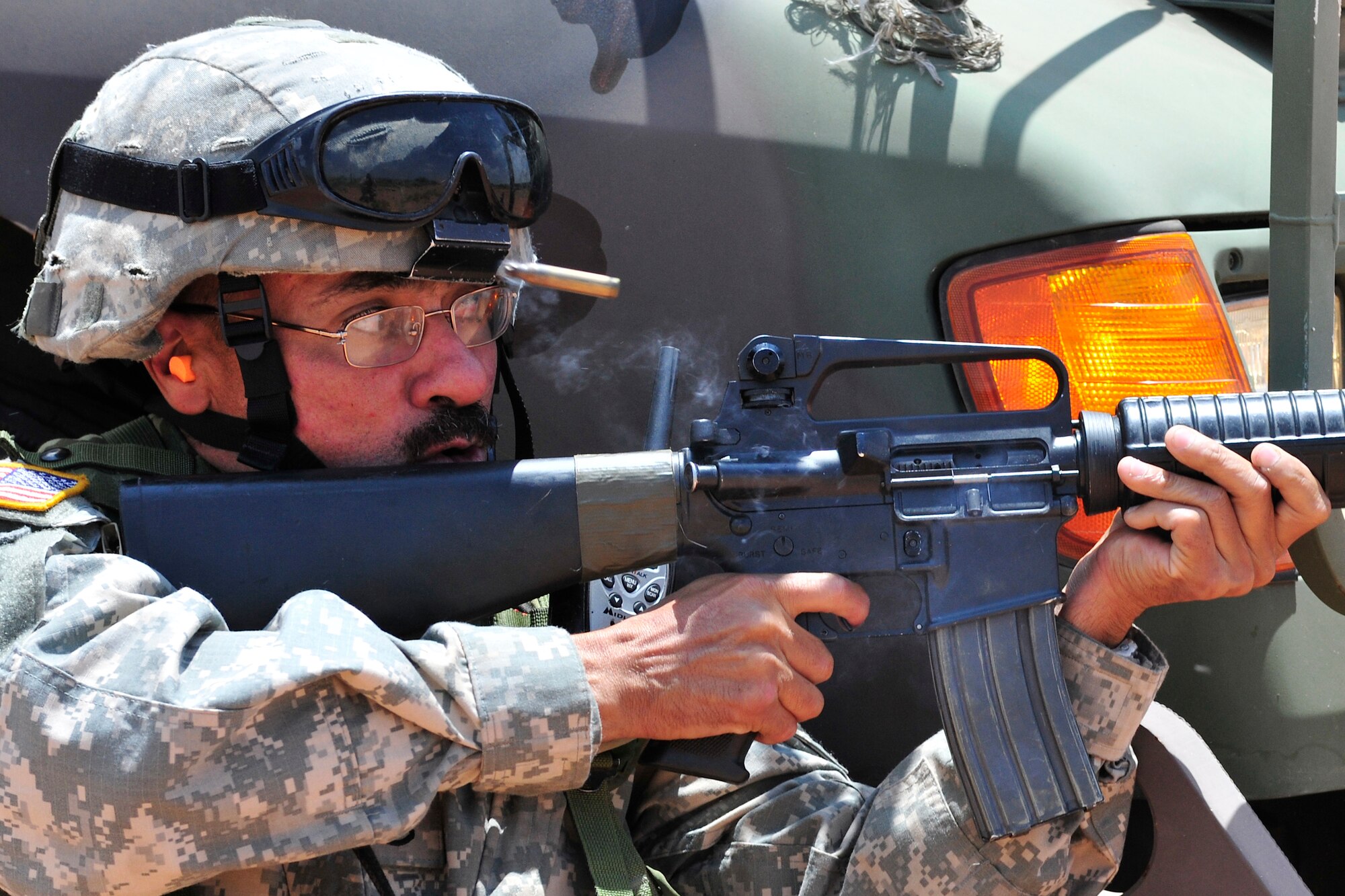 Soldier Damian Ramirez, New Mexico National Guard, 615th Transportation Battalion, returns fire with his rifle during a simulated attack, June 15. The 615th Transportation Battalion, stayed at Cannon from June 11-17 to conduct training operations at Melrose Air Force Range. The time on the range included tactics training and procedures refreshers and theater specific scenarios. (US Air Force Photo by Technical Sgt. Josef Cole)