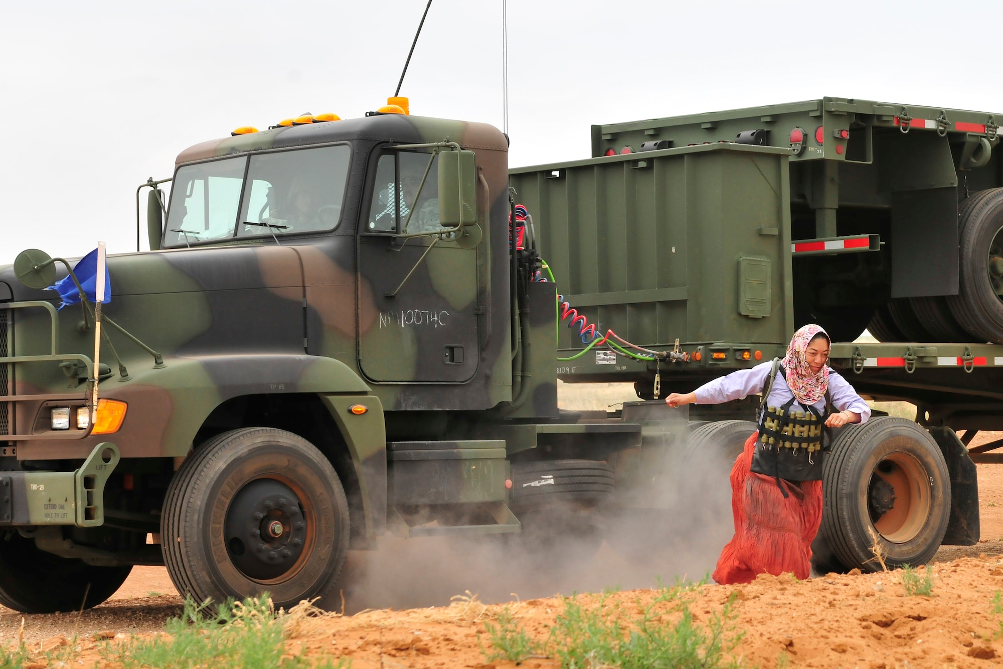 A soldier of the New Mexico National Guard, 615th Transportation Battalion, detonates a simulated bomb while posing as a opposition forces suicide bomber, June 15. The 615th Transportation Battalion, stayed at Cannon from June 11-17 to conduct training operations at Melrose Air Force Range. The time on the range included tactics training and procedures refreshers and theater specific scenarios. (US Air Force Photo by Technical Sgt. Josef Cole)