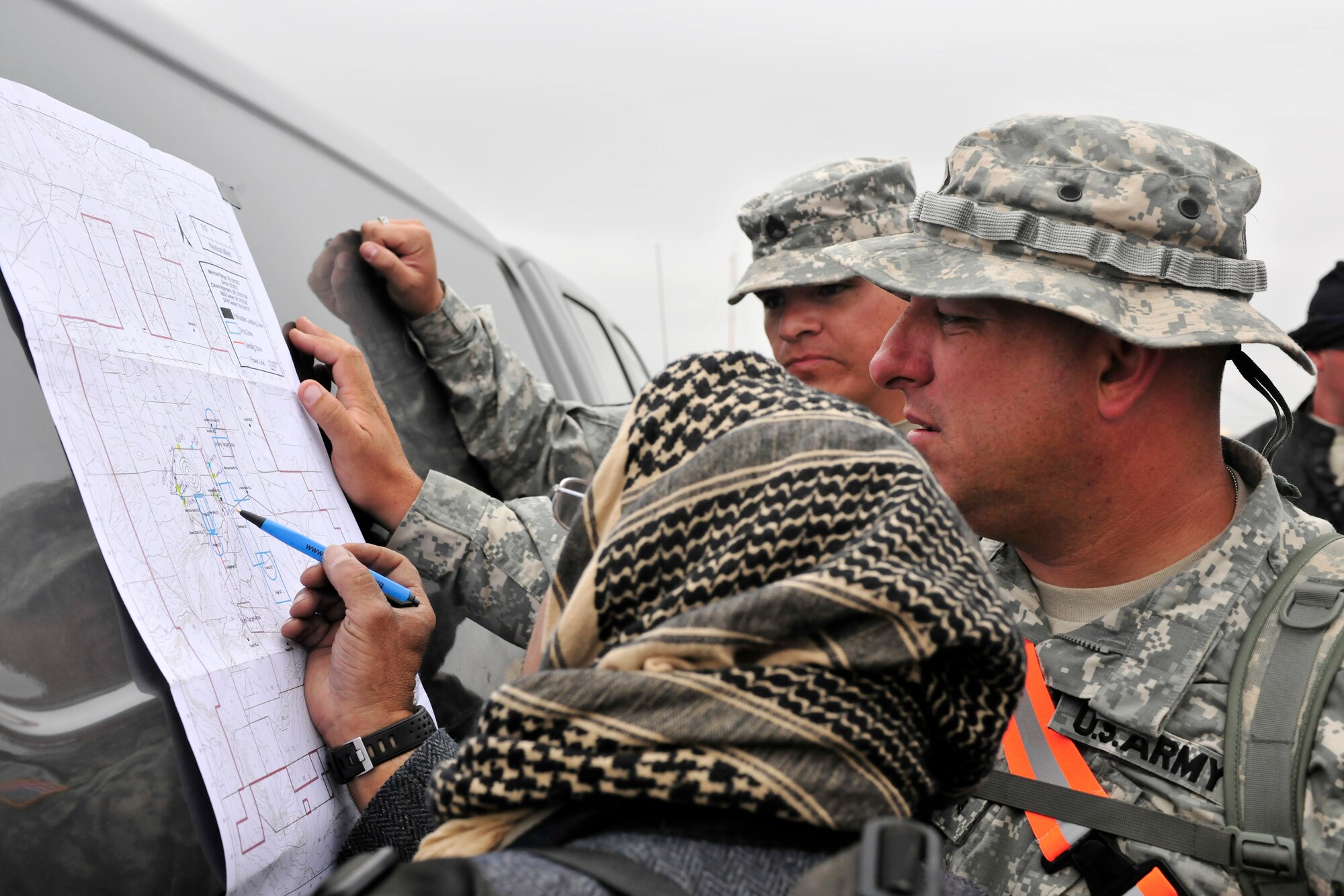 Members of the New Mexico National Guard, 615th Transportation Battalion, study a map prior to a training mission, June 15. The 615th Transportation Battalion, stayed at Cannon from June 11-17 to conduct training operations at Melrose Air Force Range. The time on the range included tactics training and procedures refreshers and theater specific scenarios. (US Air Force Photo by Technical Sgt. Josef Cole)