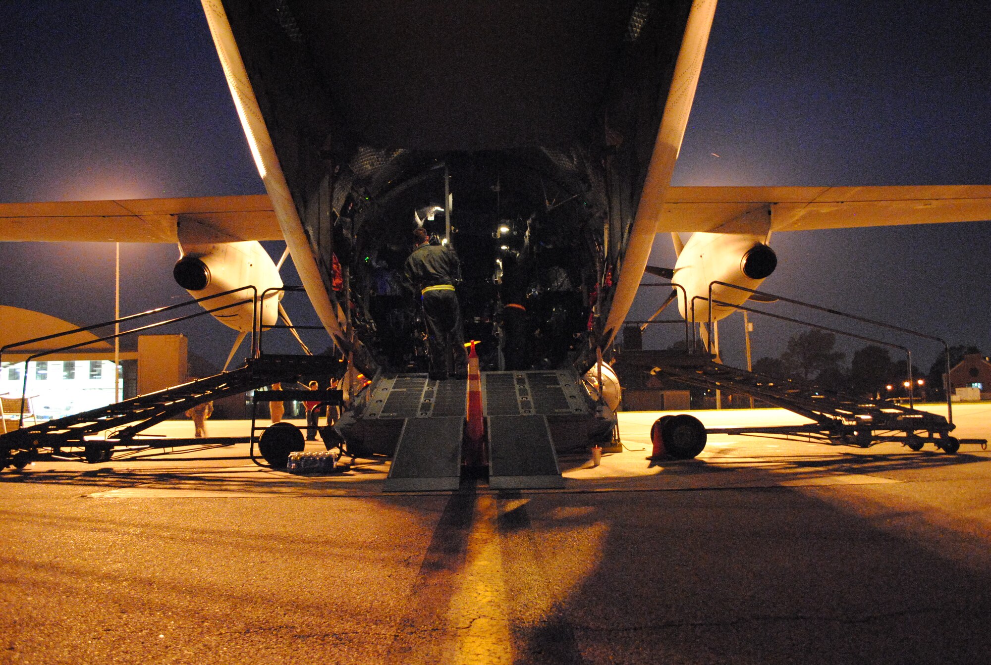SCOTT AIR FORCE BASE, Ill. -- A C-27J Spartan sits on the flightline filled with mock patients and aeromedical evacuation personnel June 8 at Scott during a production qualification test which timed emergency evacuations of all patients and aircrew through all doors and an emergency escape hatch on top of the airframe. (U.S. Air Force Photo by Bekah Clark) 