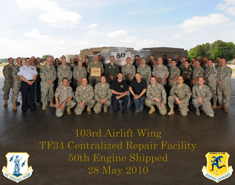 The 103rd Airlift Wing's TF-34 centralized repair facility commemorates shipping its 50th engine May 28, 2010, in the base hangar at Bradley Air National Guard Base, East Granby, Conn. In the photo are the CRF shop technician force, civilian contractors, support flight personnel and commanders. (U.S. Air Force photo by Tech. Sgt. Erin McNamara)