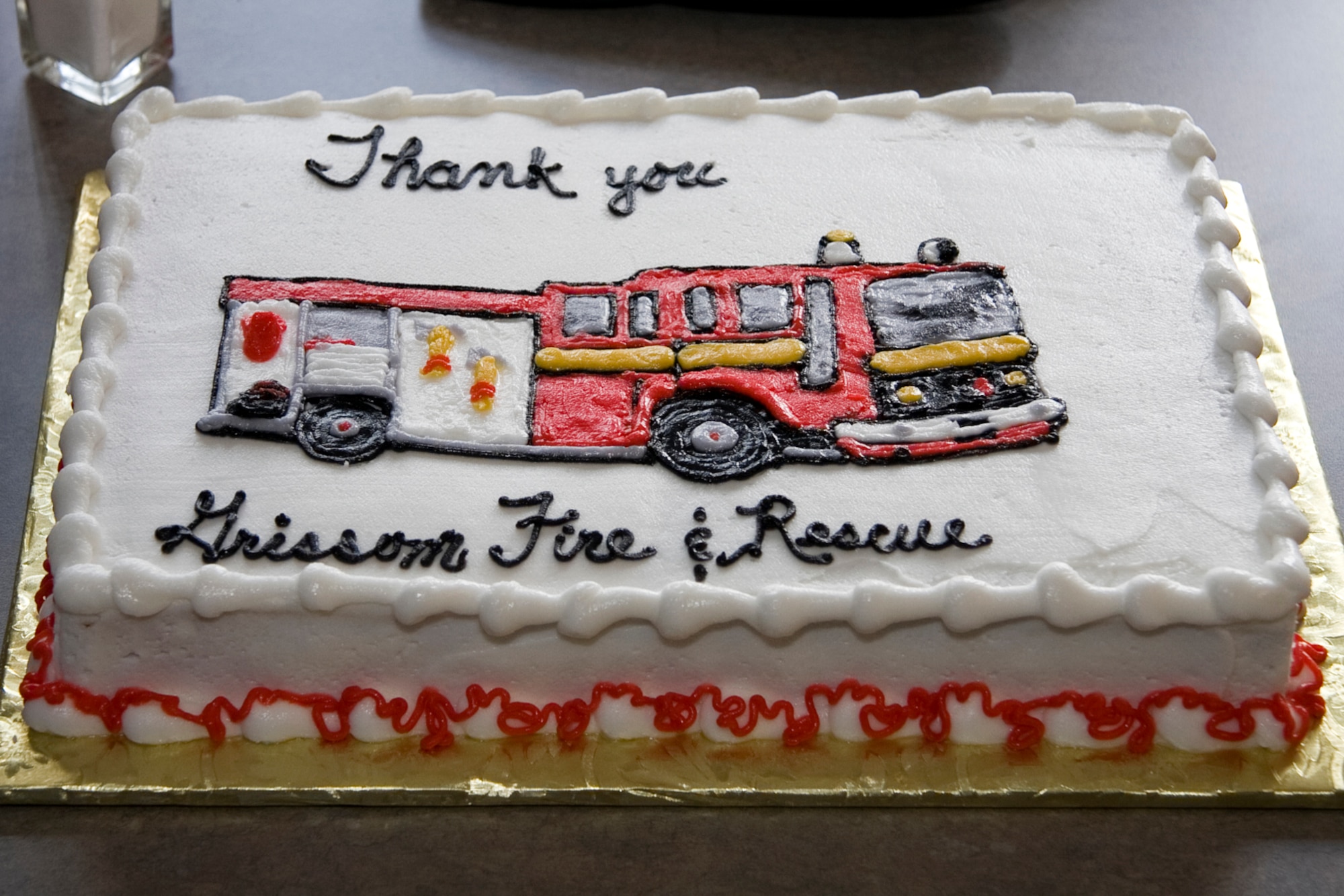 GRISSOM AIR RESERVE BASE, Ind. -- A homemade cake with a hand-drawn image of the Grissom Fire Department's Rescue 5 is seen before it was eaten by Rita Lawrence, her family and the firefighters who saved her life recently. Rescue 5's crew responded to an off-base emergency where they found Mrs. Lawrence in anaphylactic shock. Mrs. Lawrence, who attributes her life to Grissom's emergency responders, visited the base recently to thank to the men who saved her. (U.S. Air Force photo/Tech. Sgt. Mark R. W. Orders-Woempner)