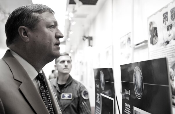 VANDENBERG AIR FORCE BASE, Calif. -- Secretary of the Air Force Michael Donley looks at a display featuring some of Vandenberg's previous launches during a tour of base facilities June 15, as Brig. Gen. Timothy Ray, Air Force Global Strike Command Director of Operations, looks on. During his visit, Secretary Donley met with base leadership, toured facilities and observed a Minuteman III launch, the first under Air Force Global Strike Command. (U.S. Air Force photo/Senior Airman Ashley Reed)