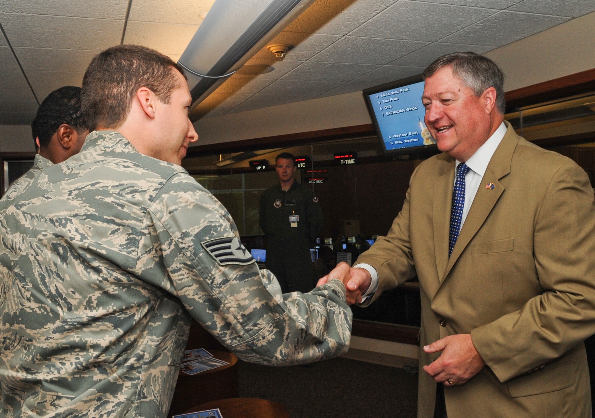 VANDENBERG AIR FORCE BASE, Calif. -- Secretary of the Air Force Michael Donley shakes hands with Staff Sgt. James Romig during a tour of the base Tuesday, June 15, 2010. During his visit, Secretary Donley met with base leadership, toured facilities and observed a Minuteman III launch, the first under Air Force Global Strike Command. (U.S. Air Force photo/Senior Airman Ashley Reed)