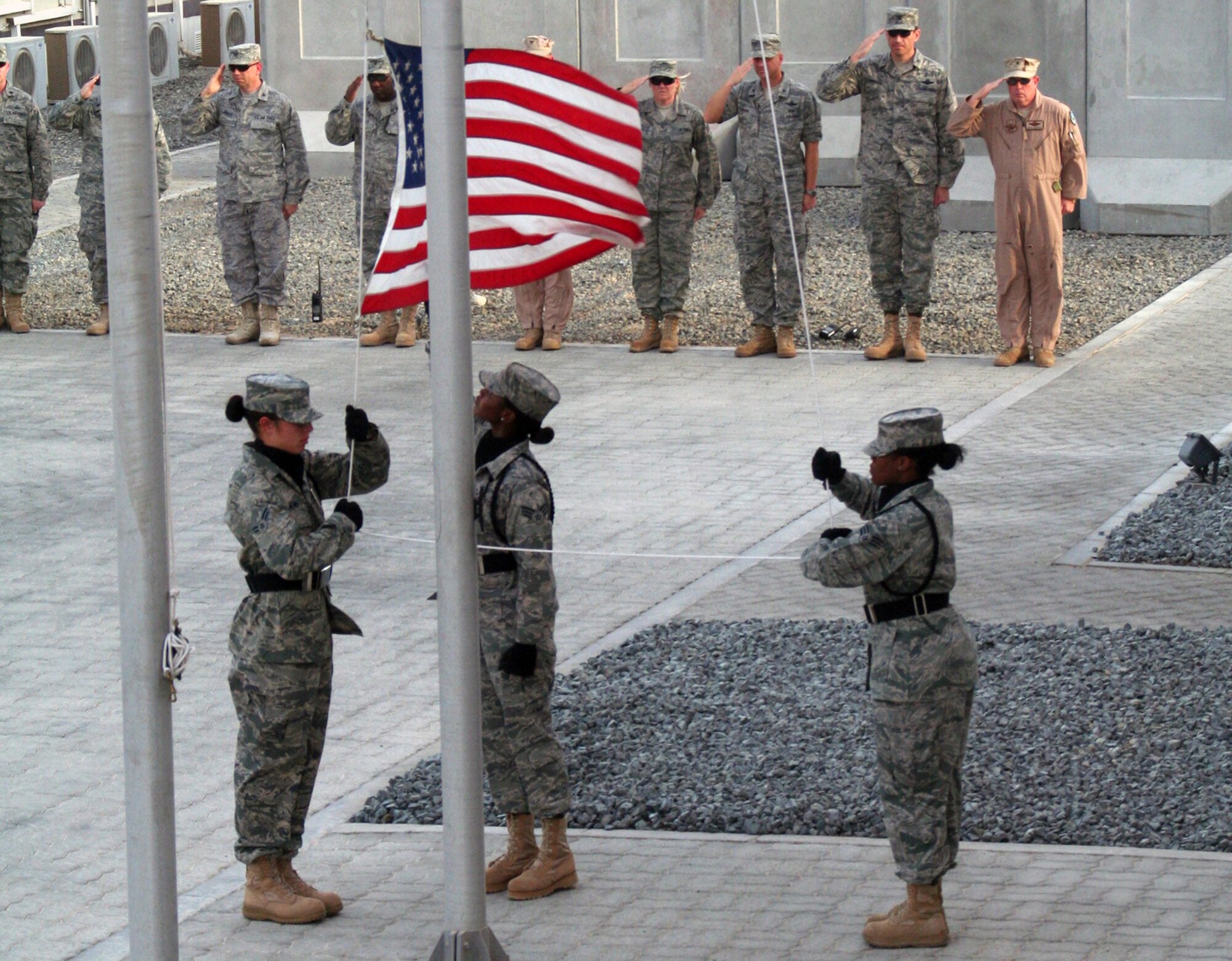 Airmen from the 380th Air Expeditionary Wing participate in a wing-wide retreat ceremony at a non-disclosed base in Southwest Asia on June 11, 2010. Every week the 380th AEW holds a retreat ceremony to honor the American flag and as part of a military tradition. During the June 11 ceremony, the 380th Expeditionary Operations Group served as the lead unit in formation. The 380th AEW supports operations Iraqi Freedom and Enduring Freedom and the Combined Joint Task Force-Horn of Africa. (U.S. Air Force Photo/Master Sgt. Scott T. Sturkol/Released)