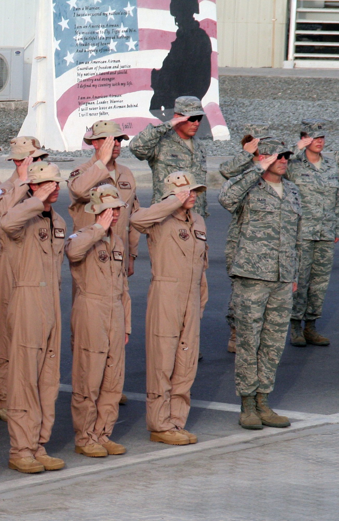 Airmen from the 380th Air Expeditionary Wing participate in a wing-wide retreat ceremony at a non-disclosed base in Southwest Asia on June 11, 2010. Every week the 380th AEW holds a retreat ceremony to honor the American flag and as part of a military tradition. During the June 11 ceremony, the 380th Expeditionary Operations Group served as the lead unit in formation. The 380th AEW supports operations Iraqi Freedom and Enduring Freedom and the Combined Joint Task Force-Horn of Africa. (U.S. Air Force Photo/Master Sgt. Scott T. Sturkol/Released)
