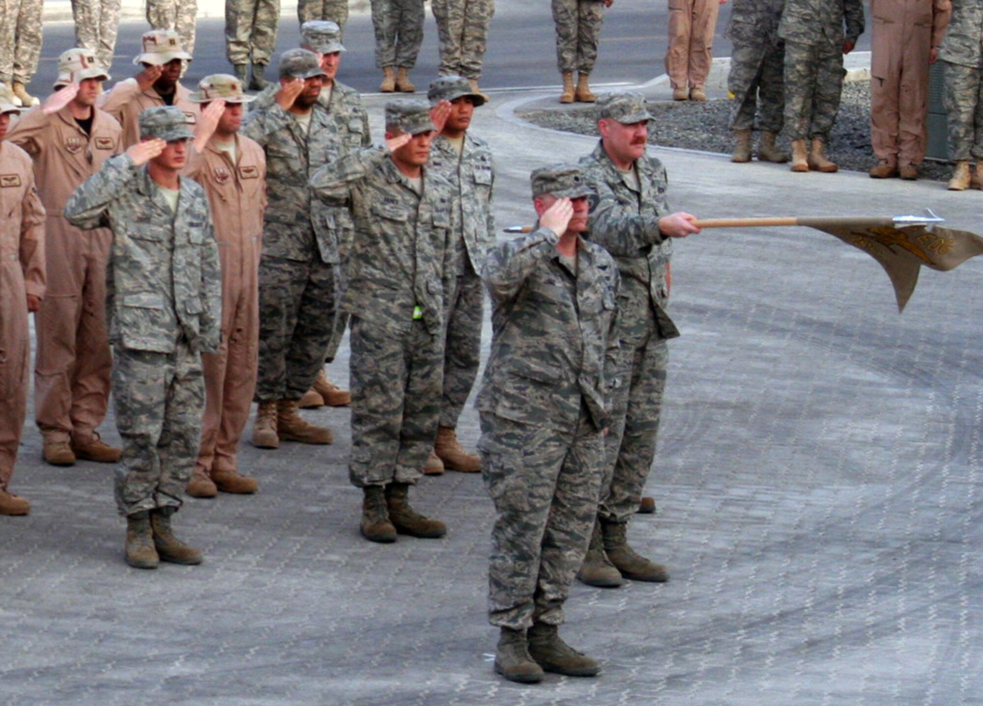 Airmen from the 380th Air Expeditionary Wing participate in a wing-wide retreat ceremony at a non-disclosed base in Southwest Asia on June 11, 2010. Every week the 380th AEW holds a retreat ceremony to honor the American flag and as part of a military tradition. During the June 11 ceremony, the 380th Expeditionary Operations Group served as the lead unit in formation. The 380th AEW supports operations Iraqi Freedom and Enduring Freedom and the Combined Joint Task Force-Horn of Africa. (U.S. Air Force Photo/Master Sgt. Scott T. Sturkol/Released)