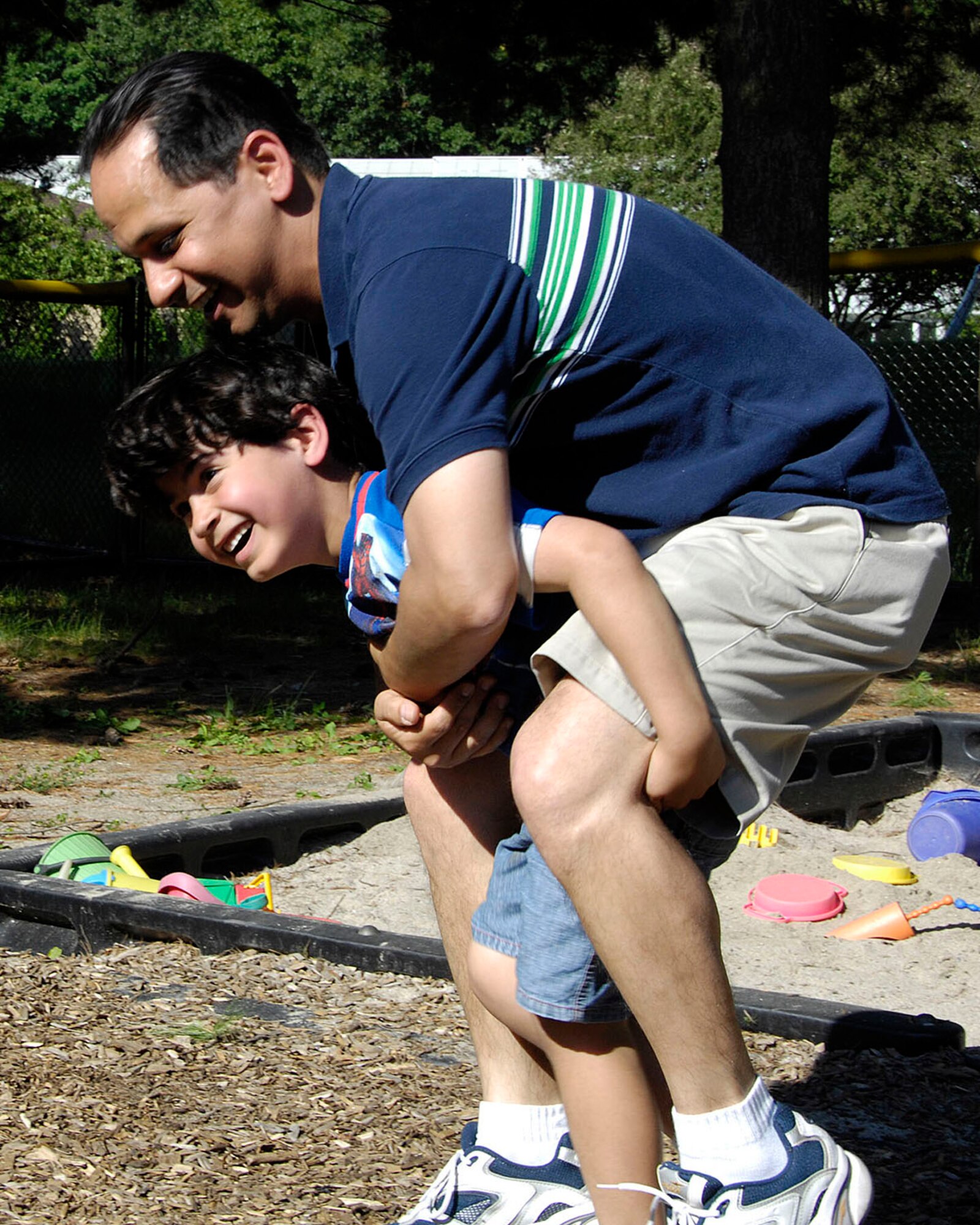 HANSCOM AIR FORCE BASE, Mass. – For Father’s Day, Staff Sgt. Matthew Ayala-Roman gets a piggy-back ride from his son Gabriel at the School Age Program Clubhouse on June 15. Matthew said that his favorite thing about his dad is, “He’s funny.” (U.S. Air Force photo by Linda LaBonte Britt)
