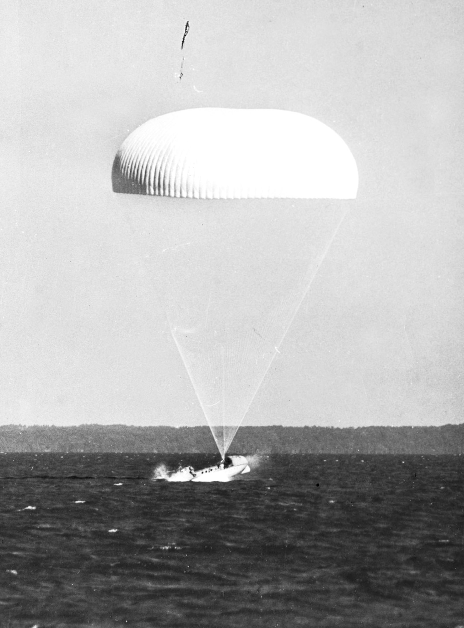 The boat hits the water and rights itself, ready for boarding. (U.S. Air Force)