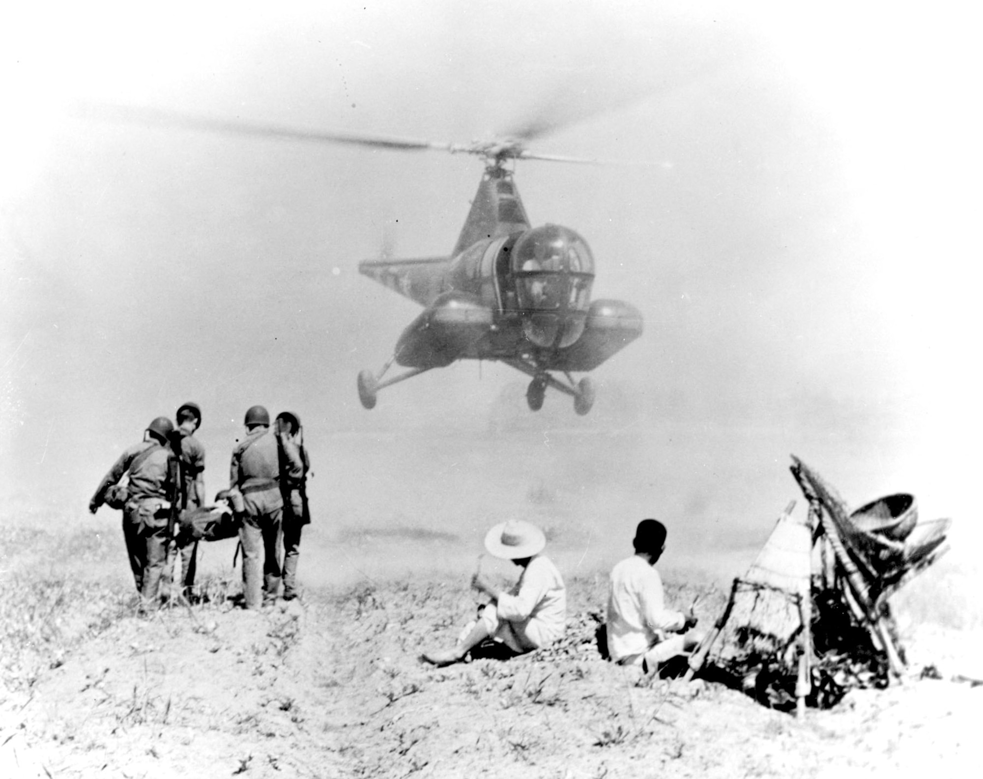 An Air Force H-5G fitted with two stretchers prepares to evacuate a wounded soldier, July 1951. (U.S. Air Force photo)